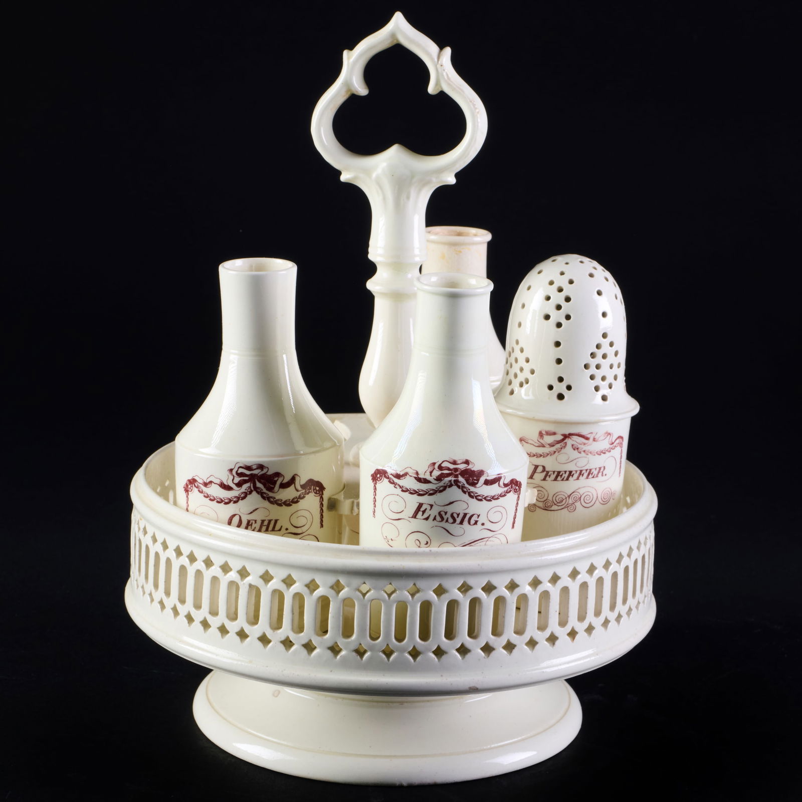 Creamware Cruet Set: Creamware Cruet SetUnmarked. Comprising: A stand A caster Three decanters 10 x 7 in. diam. The Collection of James M. Labaugh Antiques, Pound Ridge, NY.