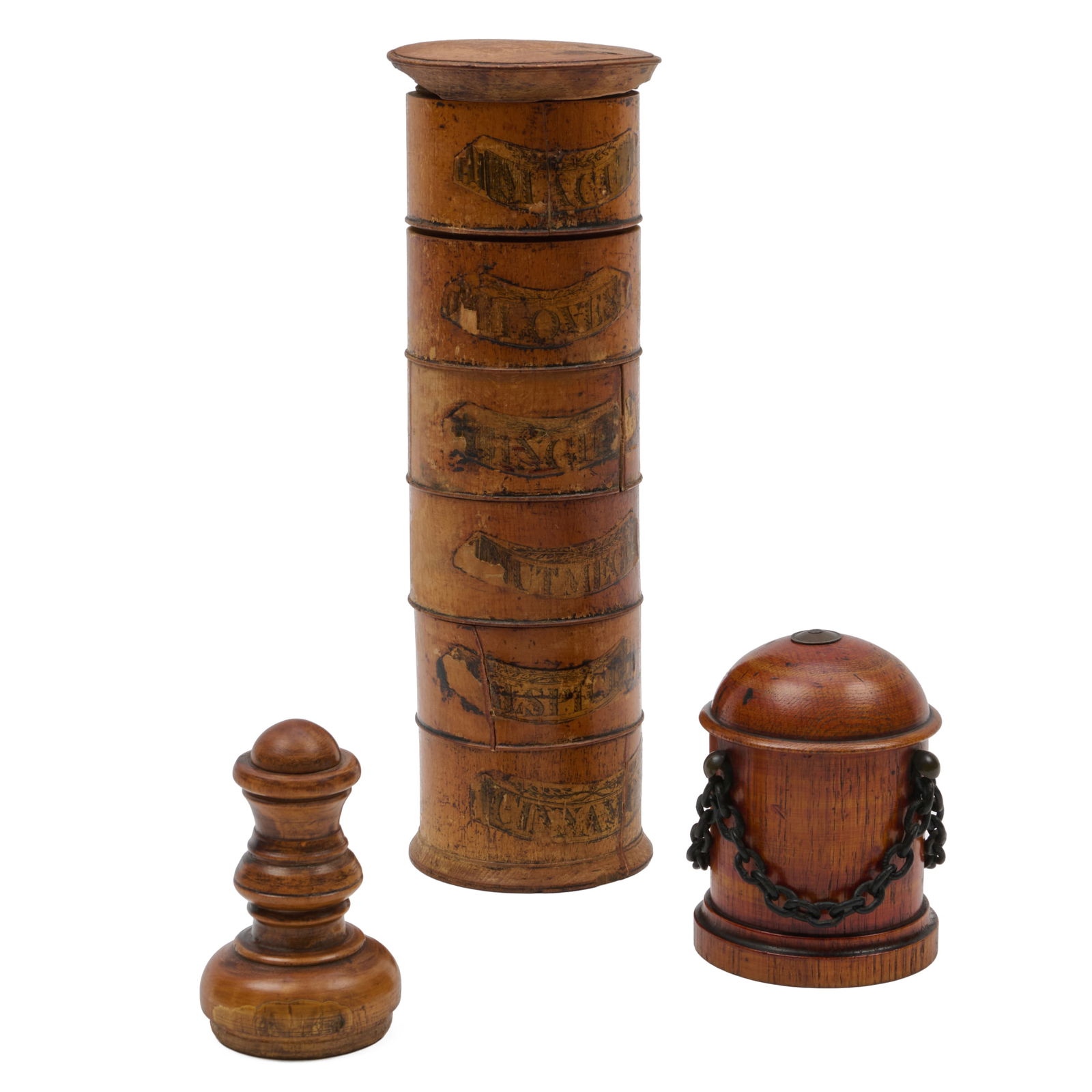 Group of Three Treen Objects: Group of Three Treen ObjectsComprising:A cylindrical stacked spice box holderA cylindrical box and cover with chain decorationA turned coverThe spice box 11 3/4 x 3 3/4 in. diam., the turned cover 4