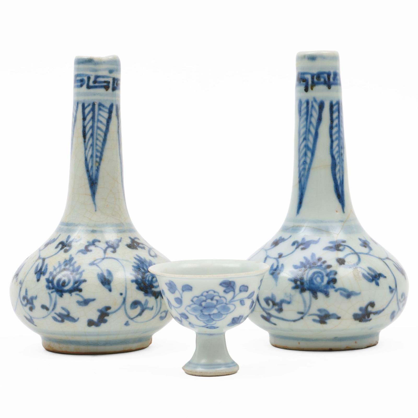 Group of Three Chinese Blue and White Porcelain Cargo Wares: Group of Three Chinese Blue and White Porcelain Cargo WaresComprising:A pair of small bottle vasesA miniature stem cupThe pair 5 1/2 x 3 in. diam., the teabowl 1 3/4 x 2 in. diam., (3 pcs).