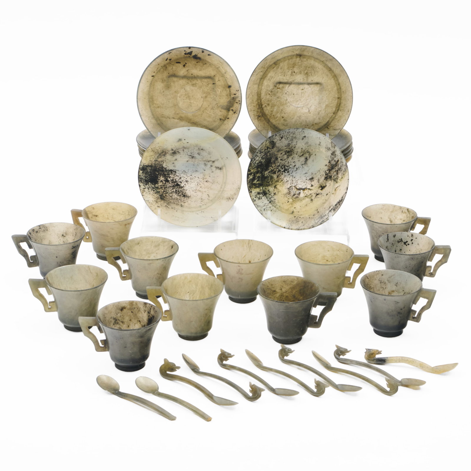 Assembled Set of Chinese Hardstone Cups, Saucers and Spoons: Assembled Set of Chinese Hardstone Cups, Saucers and Spoons Comprising: Twelve cups Thirteen saucers in two styles Ten spoons The cups and saucers 2 1/2 x 4 3/4 in. diam. (overall), the spoons 4 in. l