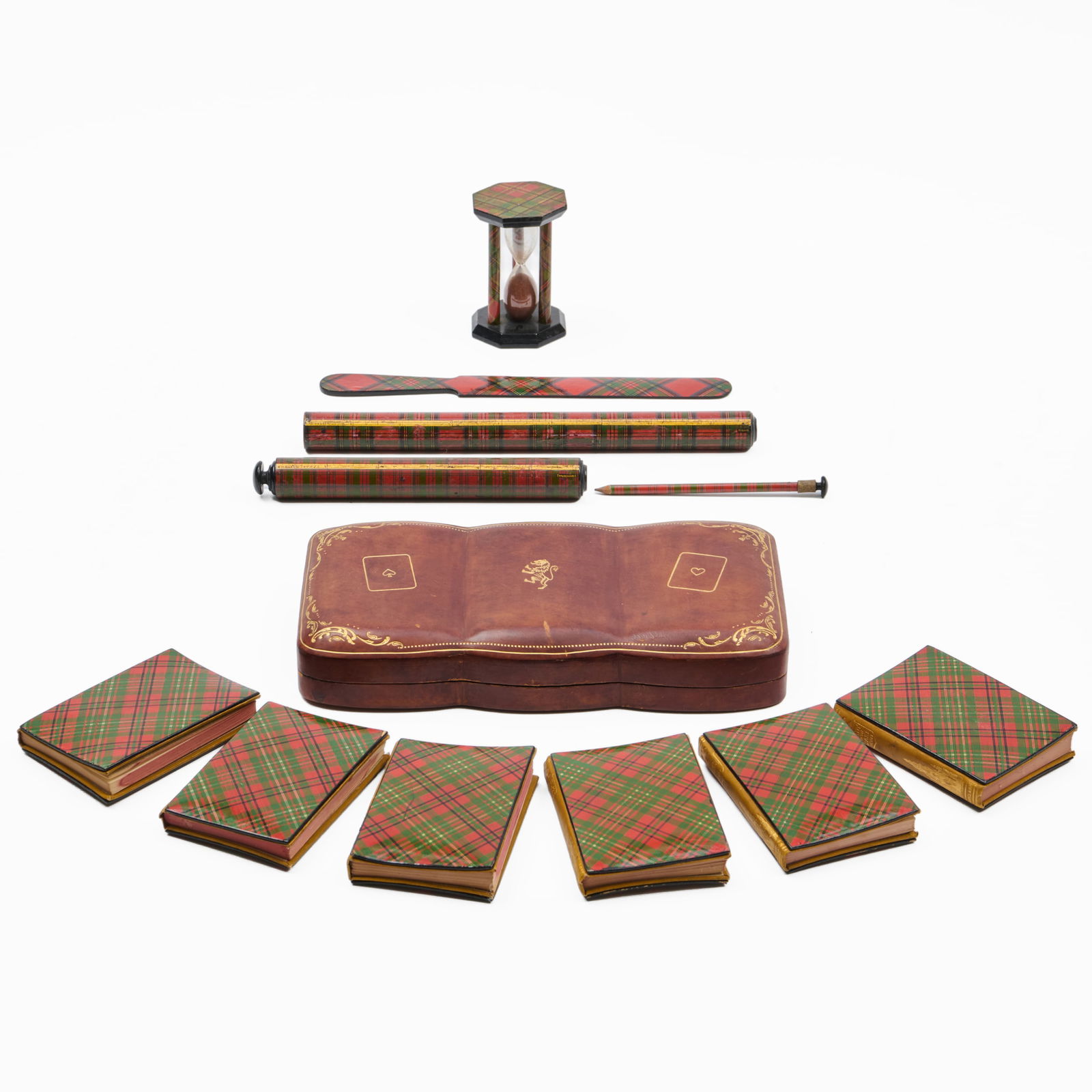 Group of Printed Tartan Ware Desk Articles: Group of Printed Tartan Ware Desk Articles Including a group of six miniature books by Sir Walter Scott.The largest 9 x 4 1/2 in., the smallest 3 1/4 x 2 1/4 in. diam. The Collection of Alan and Maril