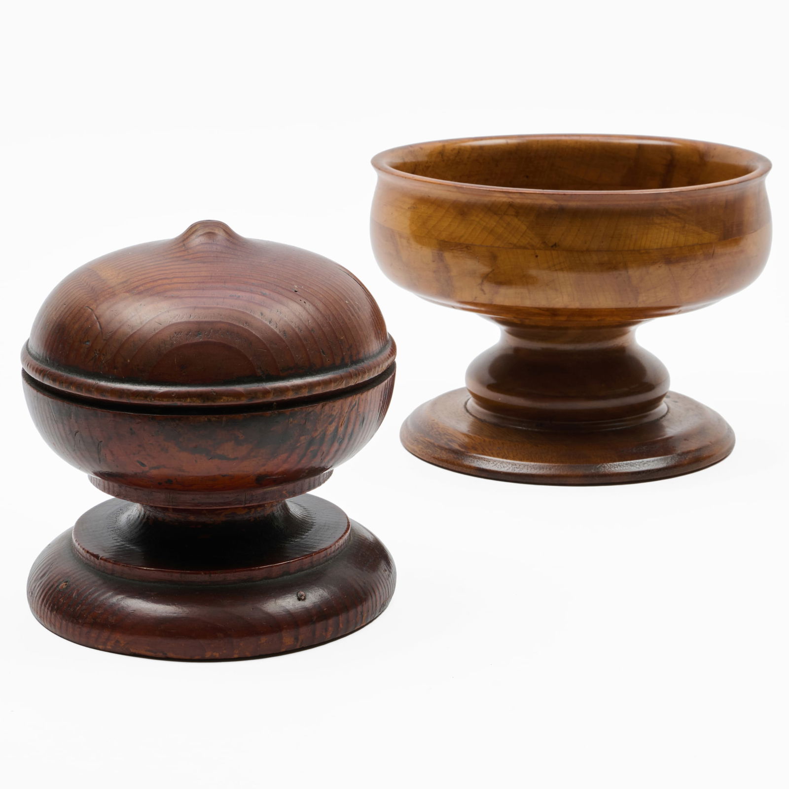 Treen Centerbowl and a Finial: Treen Centerbowl and a Finial The bowl 6 3/4 x 9 1/4 in., diam., the finial, 7 1/4 x 6 3/4 in. diam. The Collection of Alan and Marilyn Bergman.