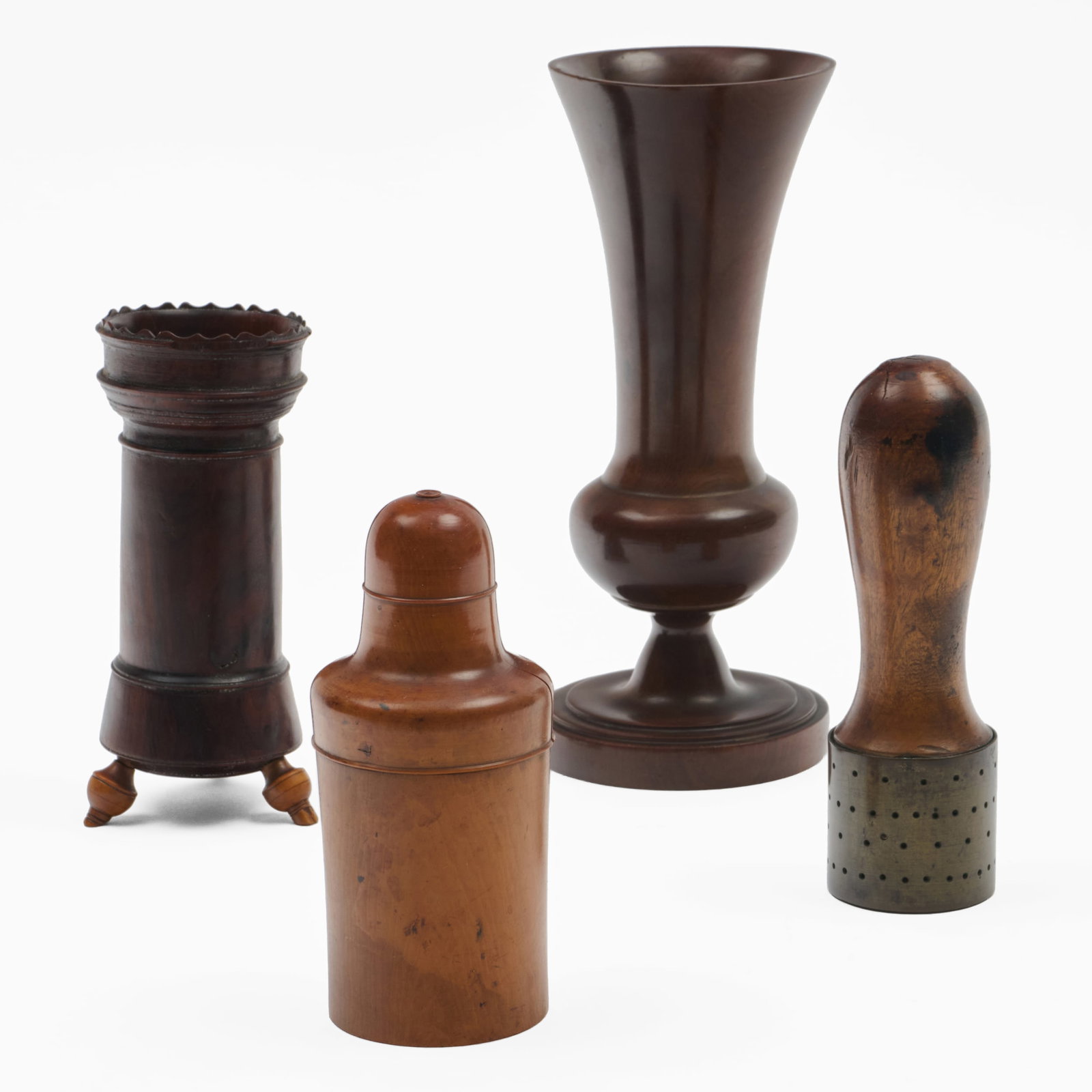 Group of Four Treen Articles: Group of Four Treen Articles The tallest 8 1/2 x 3 3/4 in., the smallest, 5 1/2 in. x 2 1/4 in. diam. The Collection of Alan and Marilyn Bergman.