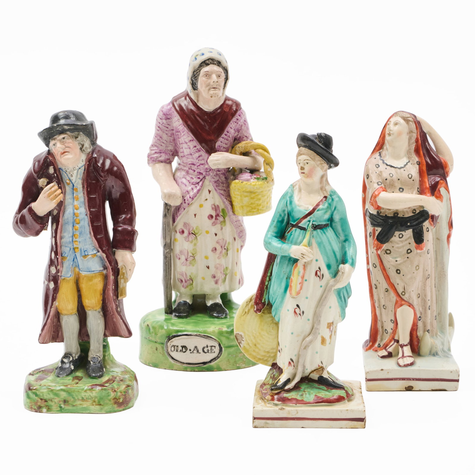 Group of Four Staffordshire Figures: Group of Four Staffordshire Figures Unmarked.The tallest figure 9 x 3 1/2 x 3 1/2 in., the shortest 6 3/4 x 2 5/8 x 2 5/8 in., (4 pcs). The Collection of Alan and Marilyn Bergman.