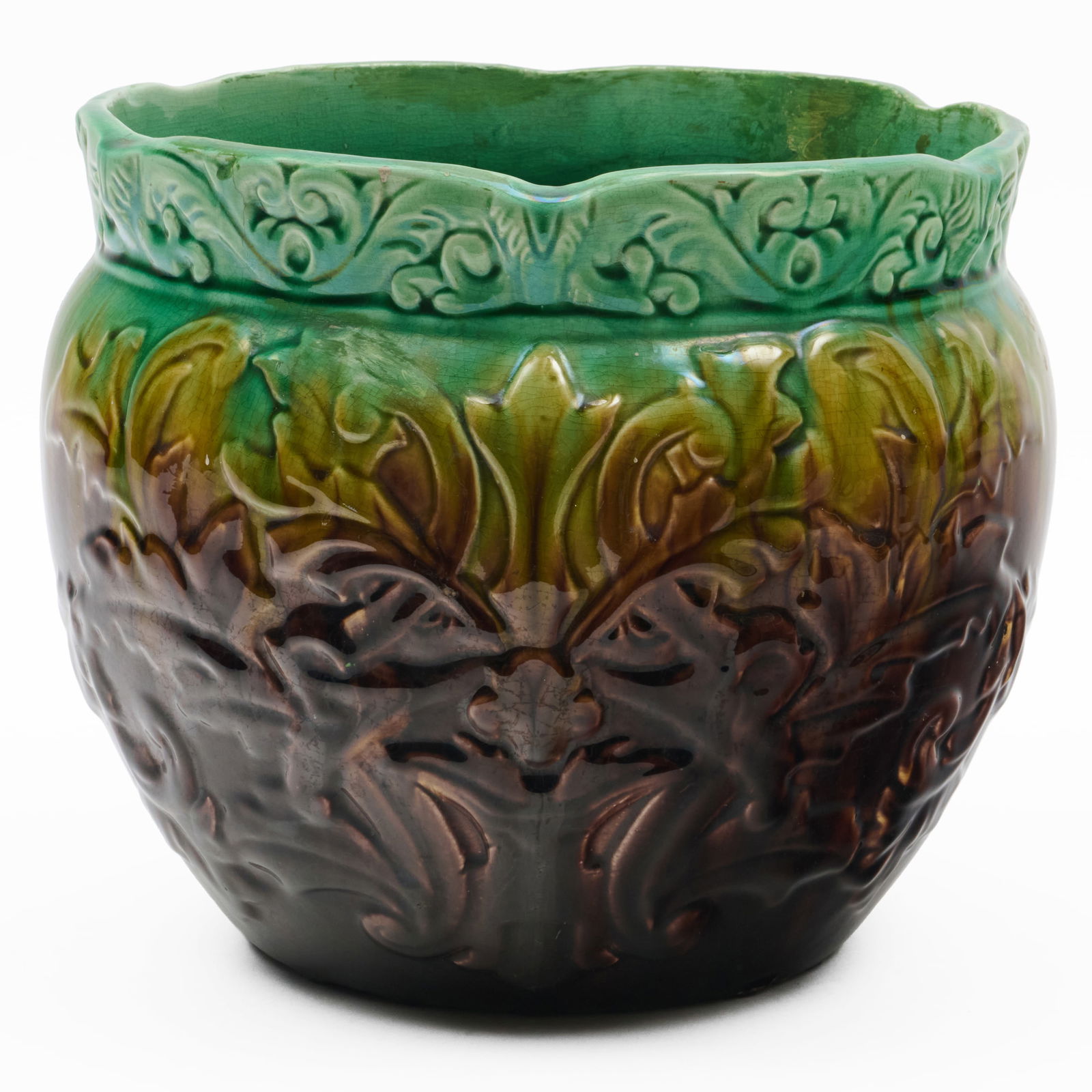 Small Majolica Green and Brown Glazed Jardiniere: Small Majolica Green and Brown Glazed Jardiniere Unmarked.8 1/2 x 10 in. diam. The Collection of Alan and Marilyn Bergman.