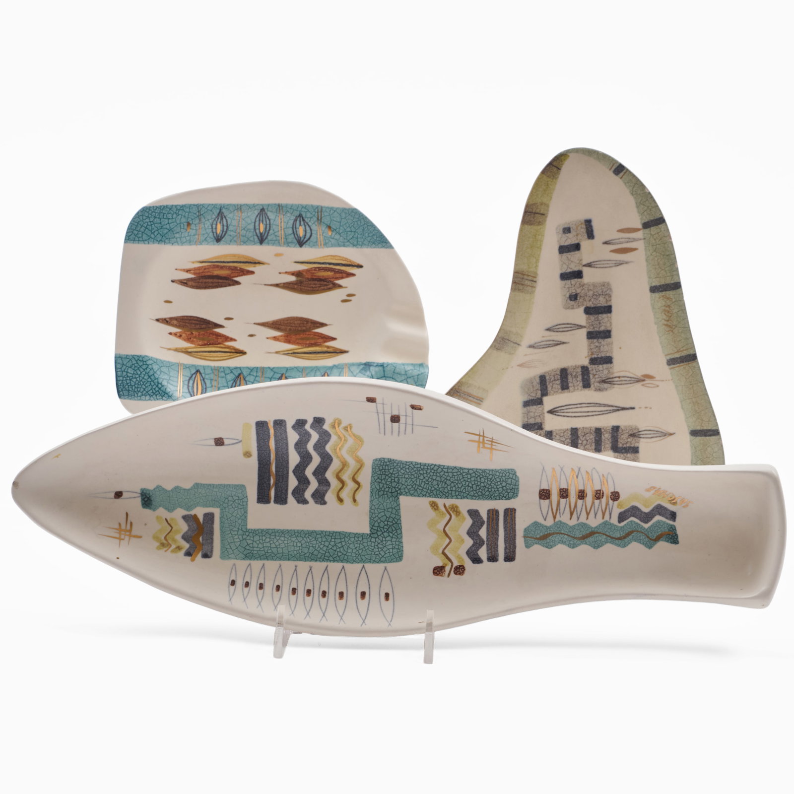 Group of Three Sascha Brastoff Pottery Dishes: Group of Three Sascha Brastoff Pottery Dishes Printed mark.Comprising:A fish shaped dishTwo abstract vide pocheThe largest 13 3/4 x 4 1/2 in. Collection of Barbara Jakobson.