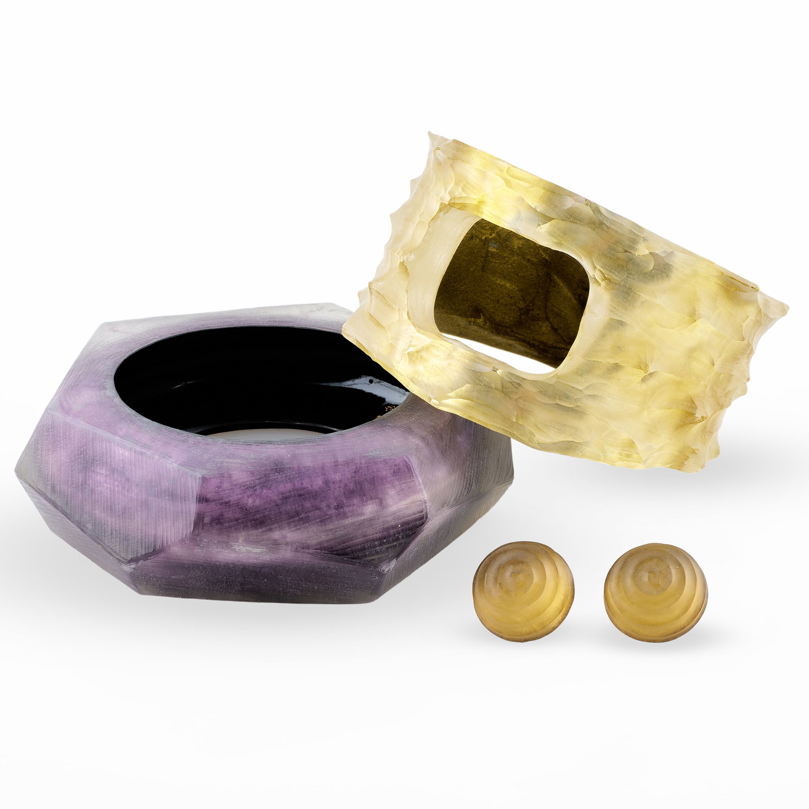 Group of Alexis Bittar Carved Lucite Jewelry: Group of Alexis Bittar Carved Lucite Jewelry With label. Comprising:A gold colored braceletA purple colored braceletA pair of gold colored earringsThe gold bracelet 2 1/2 in. diam. (interior), 3 1/2