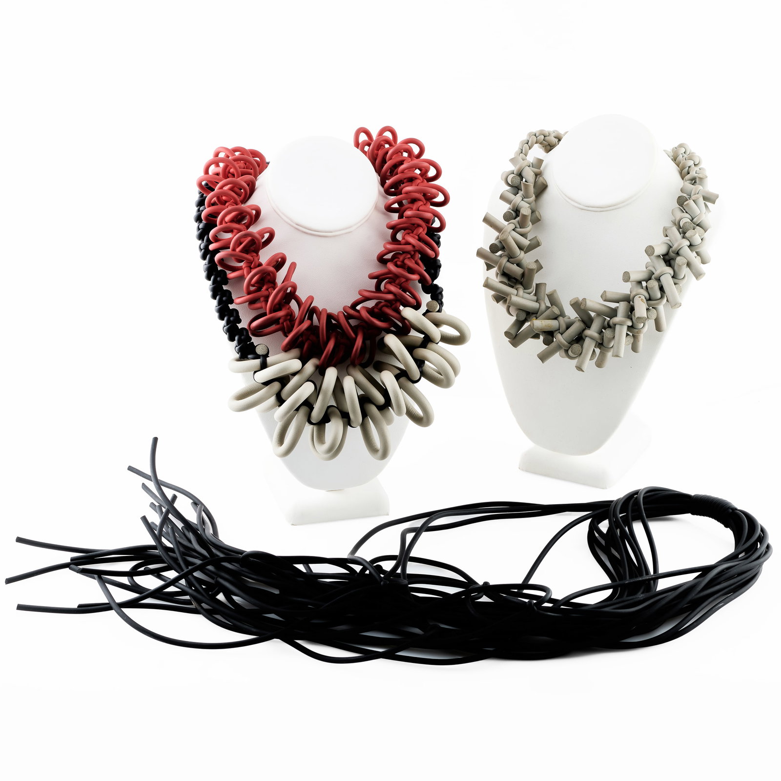 Group of Four Rosanna Contadini for Neo Design Neoprene Art Necklaces: Group of Four Rosanna Contadini for Neo Design Neoprene Art Necklaces Comprising:A red loop necklaceA black knot and tail necklaceA grey knot and bar necklaceA black and grey loop necklaceThe black