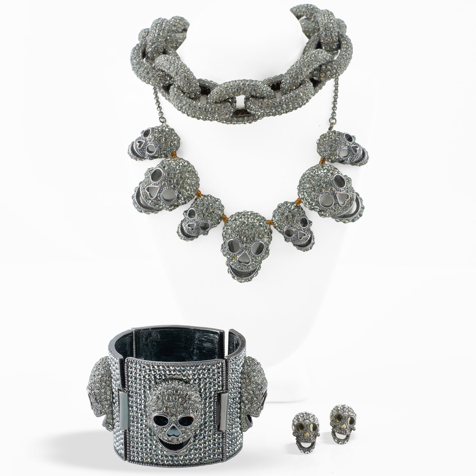 Set of Rhinestone Skeleton Jewelry: Set of Rhinestone Skeleton Jewelry Comprising:Two necklacesA braceletA pair of earringsBracelet 6 1/2 in., skull necklace 17 in. Collection of Barbara Jakobson.