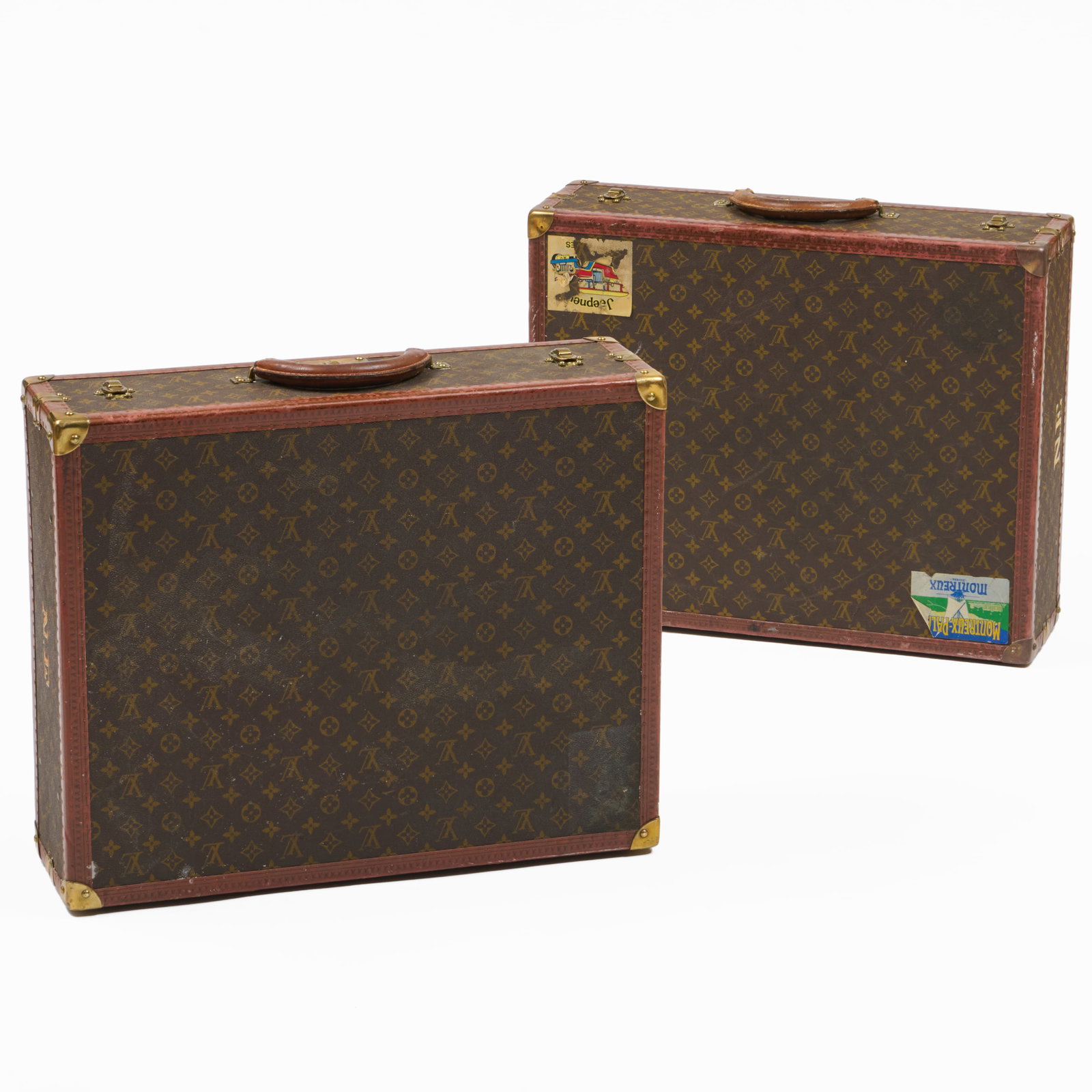 Two Louis Vuitton Leather Suitcases: Two Louis Vuitton Leather Suitcases Both with travel stickers, monogrammed NE, the hardware marked 114156 Louis Vuitton Made in France. 7 x 23 1/2 x 19 1/4 in.