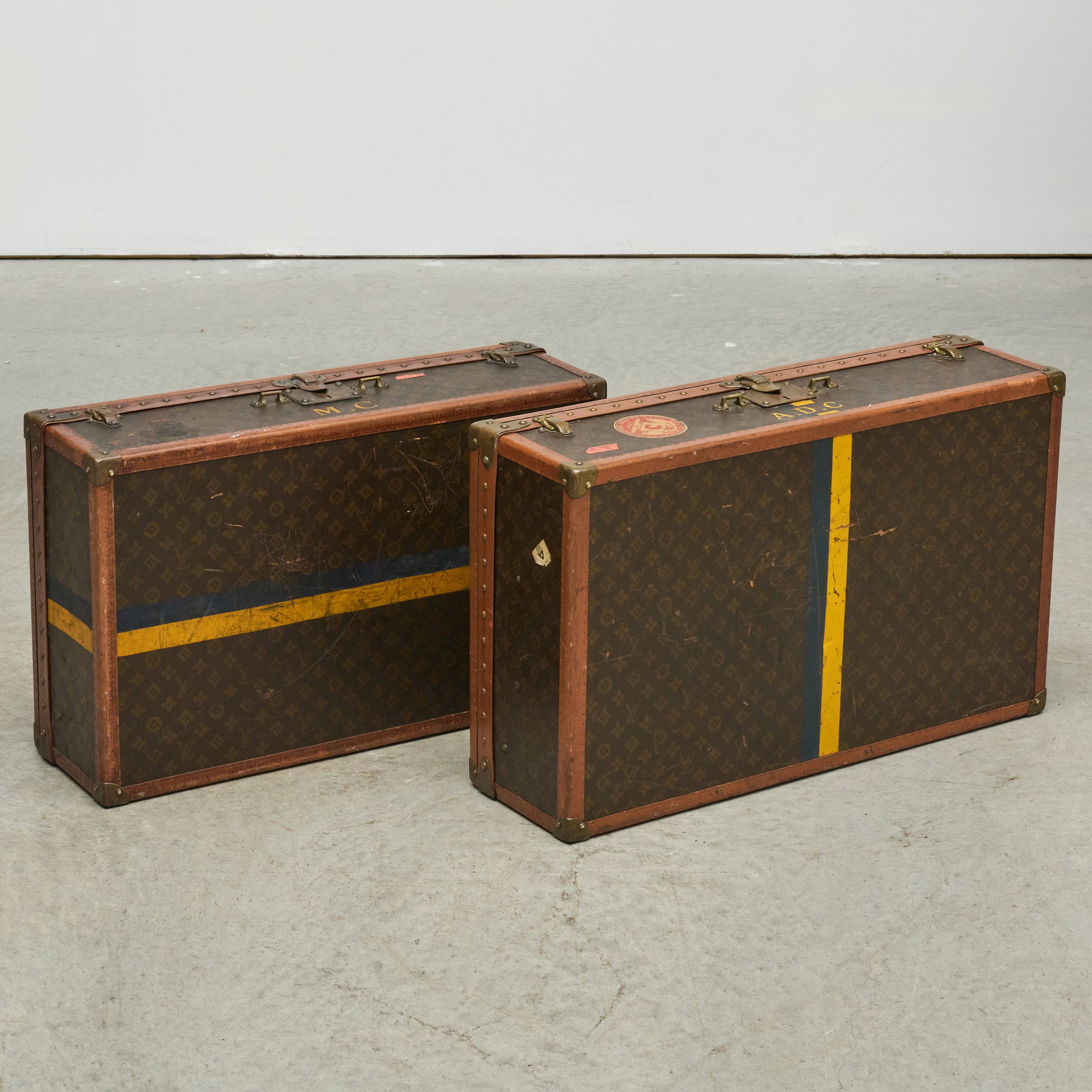 Two Louis Vuitton Leather Suitcases: Two Louis Vuitton Leather Suitcases One with serial number 737751 measuring 9 x 30 x 18 in.The other with serial number indiscernible, 9 x 28 x 17 1/2 in.