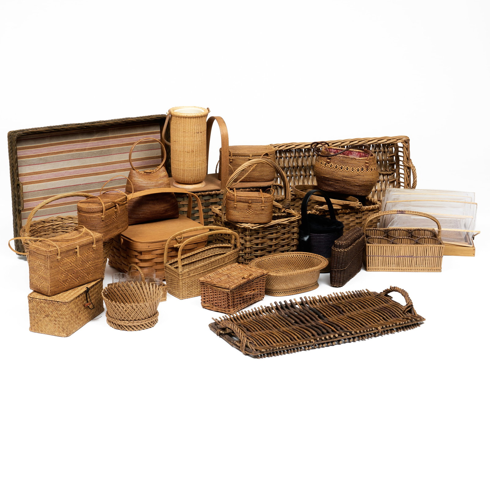 Large Group of Baskets, Trays, and Woven Handbags: Large Group of Baskets, Trays, and Woven Handbags Together with a set of wicker and mesh food covers. The largest, a handled basket, 7 x 23 1/2 x 13 in.The smallest, a handbag, 4 x 6 1/2 x 3 1/2 in.