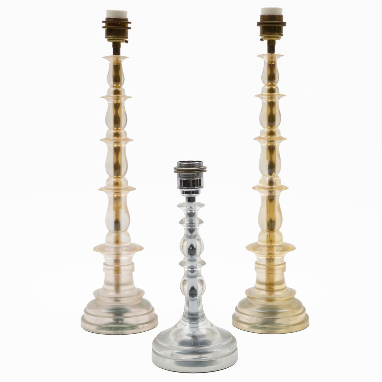 Pair of Marianna Kennedy Clear Resin Table Lamps and a Smaller Single Table Lamp: Pair of Marianna Kennedy Clear Resin Table Lamps and a Smaller Single Table Lamp Together with three shades.The pair of lamps 21 x 5 1/4 in. diam. (to socket), the single 11 3/4 x 5 in. diam. (to sock