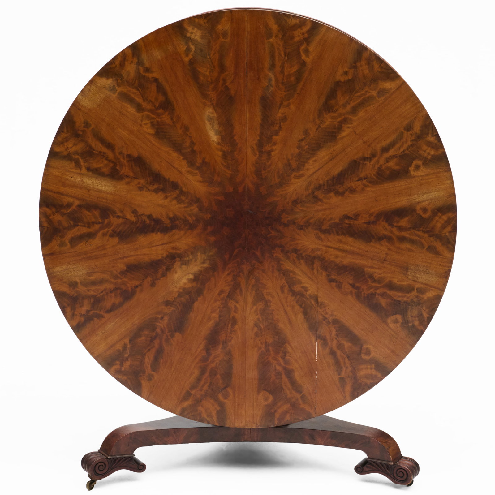 William IV Figured Mahogany Tilt-Top Center Table: William IV Figured Mahogany Tilt-Top Center Table Raised on casters.27 x 4 ft. 3 1/2 in. Beedle Coram, Spitalfields, London.Collection of Nancy McClelland.