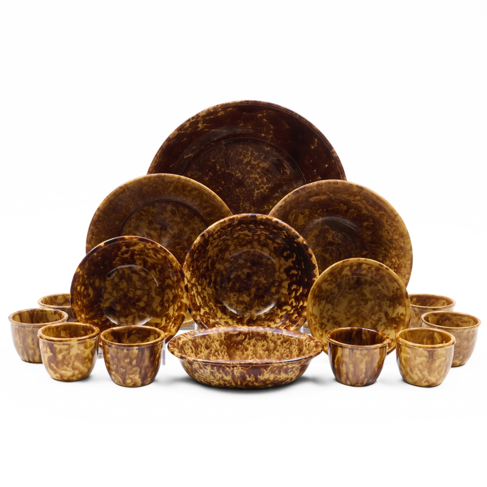 Large Group of Mottle Glazed Pottery: Large Group of Mottle Glazed Pottery Various impressed marks or unmarked.Comprising:Three flared bowls in three sizesFour bowls in graduated sizesAn open vegetable dishTwelve ramekinsThe largest 5 x