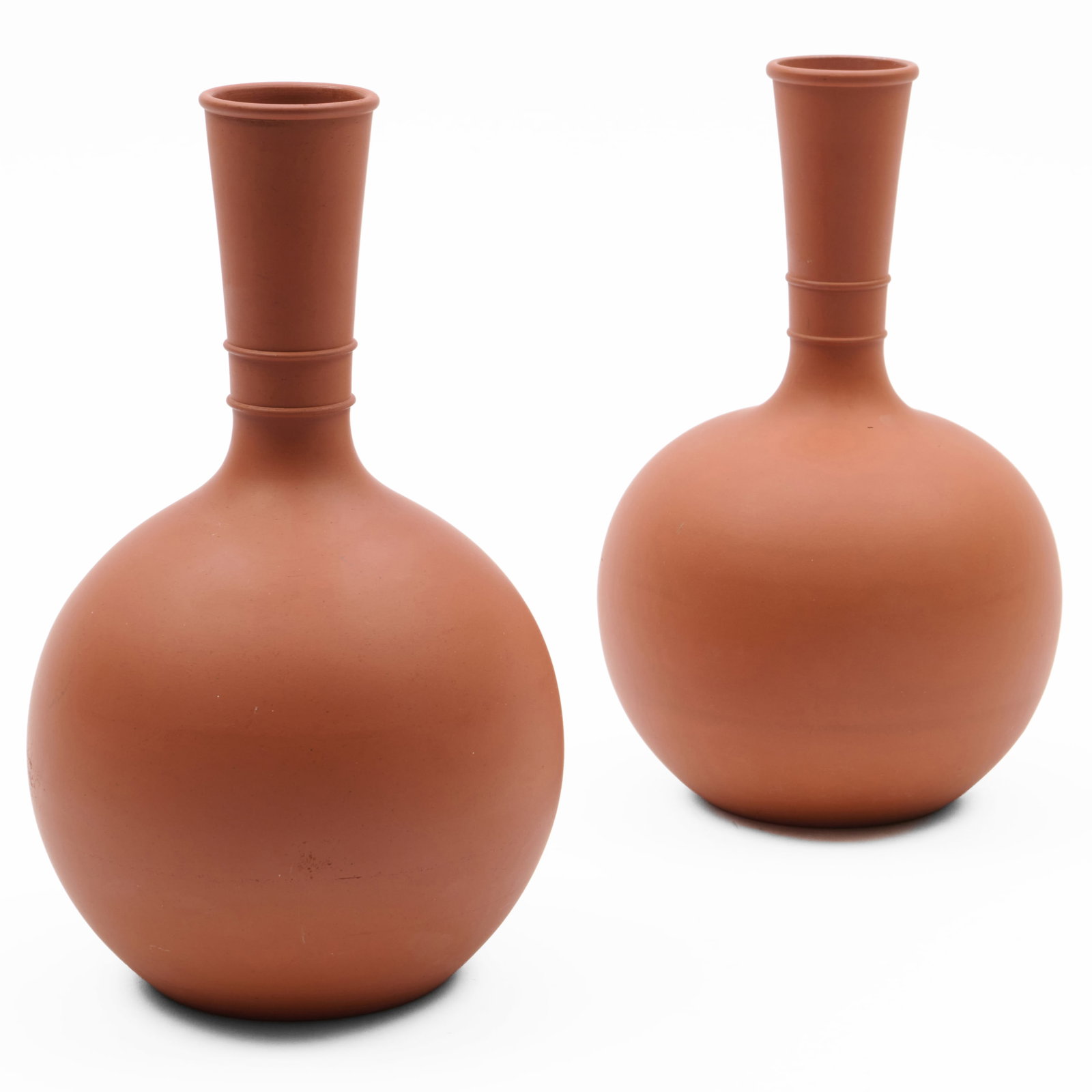 Near Pair of Matte Terracotta Vases, Possibly Wedgwood: Near Pair of Matte Terracotta Vases, Possibly Wedgwood Unmarked.The larger 10 1/4 x 5 1/4 in. diam., the smaller 9 3/4 x 5 1/4 in. diam. Collection of Nancy McClelland.