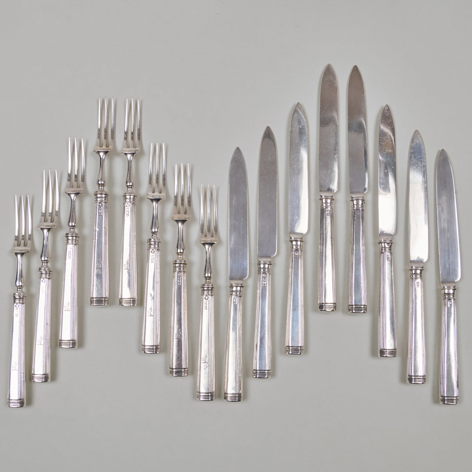 George V Silver Fruit Service for Eight Engraved with Crest: George V Silver Fruit Service for Eight Engraved with Crest Mark of Martin, Hall & Co., Sheffield, 1911; each with filled handles. The forks 6 5/8 in. long, the knives 6 7/8 in. long, (16 pcs).