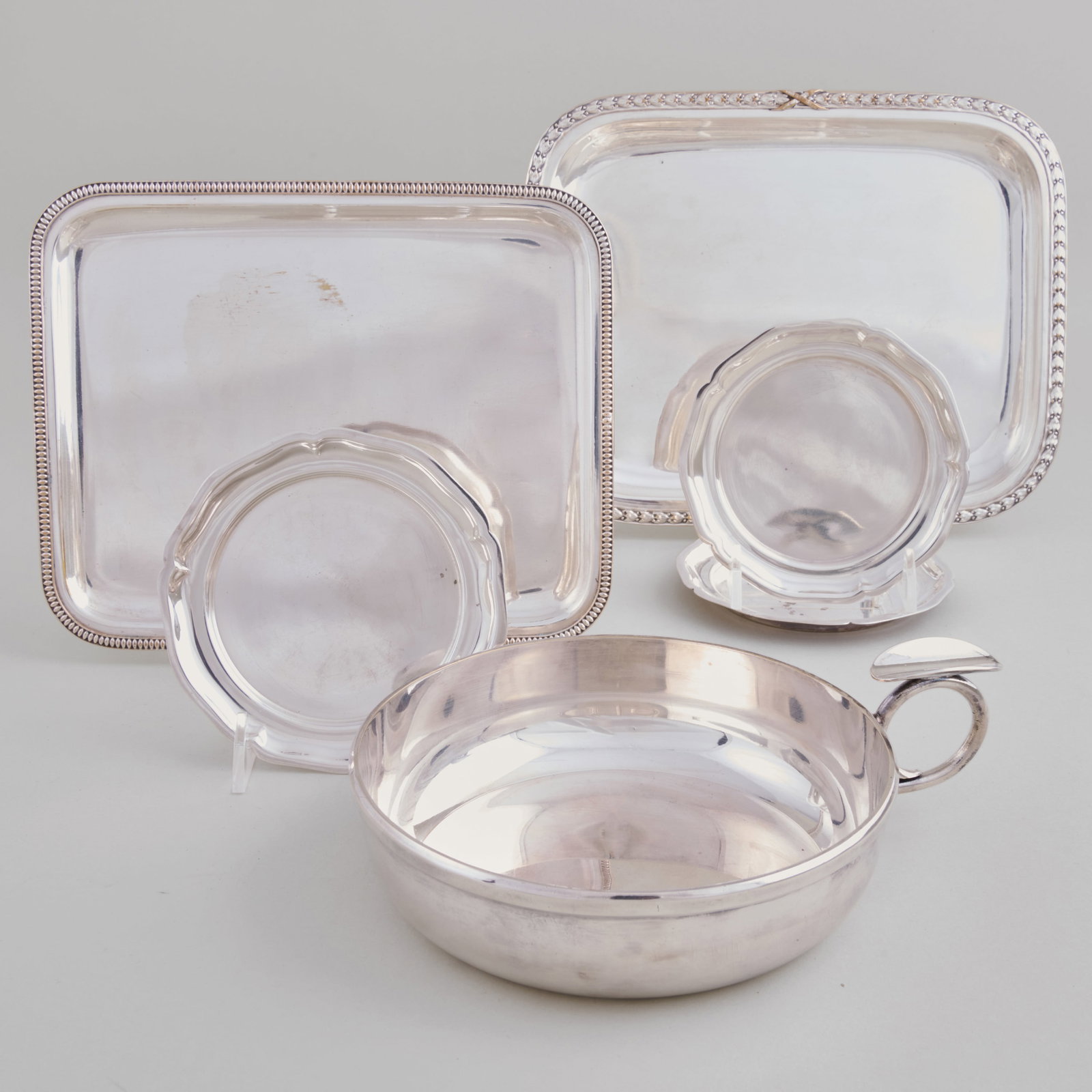 Group of Silver Plate Trays & Vide Poche: Group of Silver Plate Trays & Vide Poche Comprising:A Christofle rectangular trayA smaller rectangular silver plate trayThree circular vide pocheA large vide pocheThe Christofle tray 7 1/4 x 9 1/4