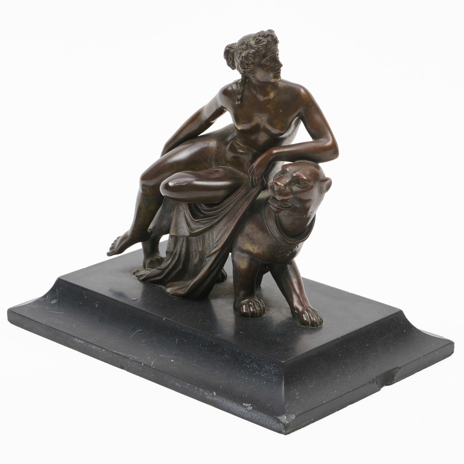 Bronze Model of a Classical Female Sitting on a Panther : Bronze Model of a Classical Female Sitting on a Panther Unsigned. Raised on a marble plinth base.6 3/4 x 7 3/4 x 4 3/4 in. Collection of Percival Paul Steinhart, III.