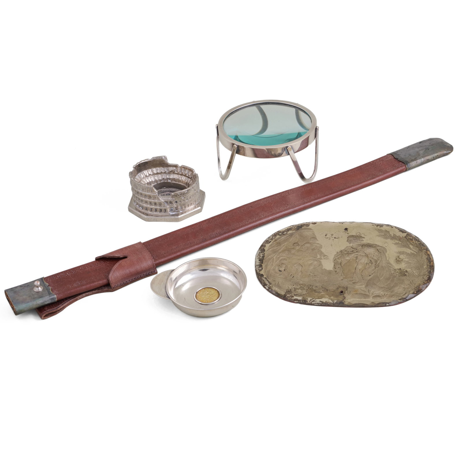 Group of Objet d'Art: Comprising:A leather sword scabbardA verre eglomise panelAn Italian silver wine tasterA Ralph Lauren chrome magnifierA metal model of the Colosseum in RomeThe scabbard 26 in. long