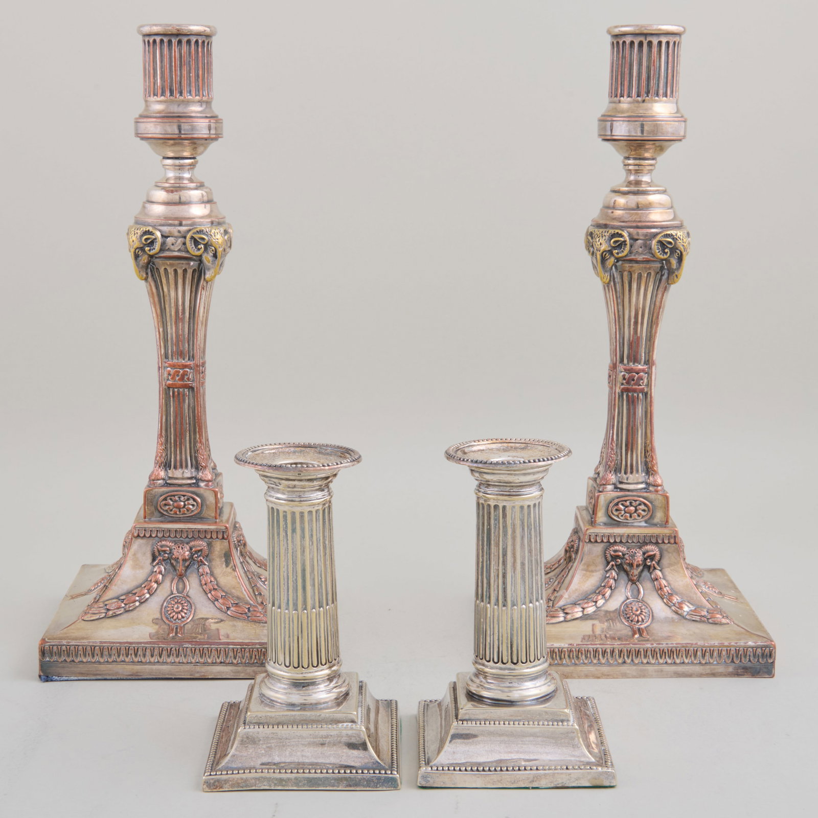 Two Pairs of Silver Plate Columnar Candlesticks: The larger 12 x 5 x 5 in., the smaller 5 1/8 x 3 1/8 x 3 1/8 in.