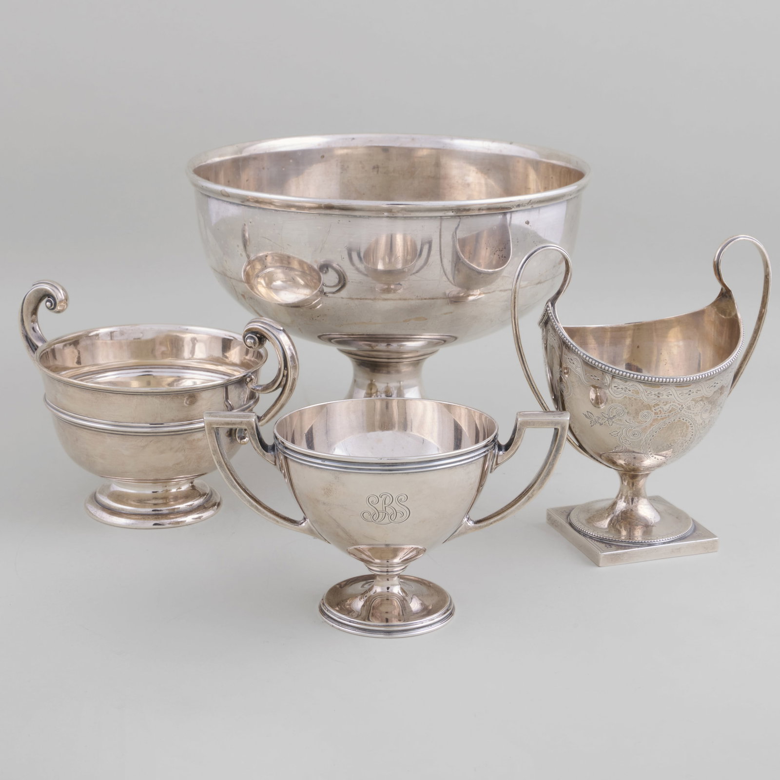 Two American and an Edward VII Silver Vessels: Comprising: A Shreve, Crump & Low vessel, marked 'Sterling' A Tiffany & Co. vessel, marked 'Sterling' An English vessel, marked London, 1904, maker's mark indistinct Together with a silver plate bowl