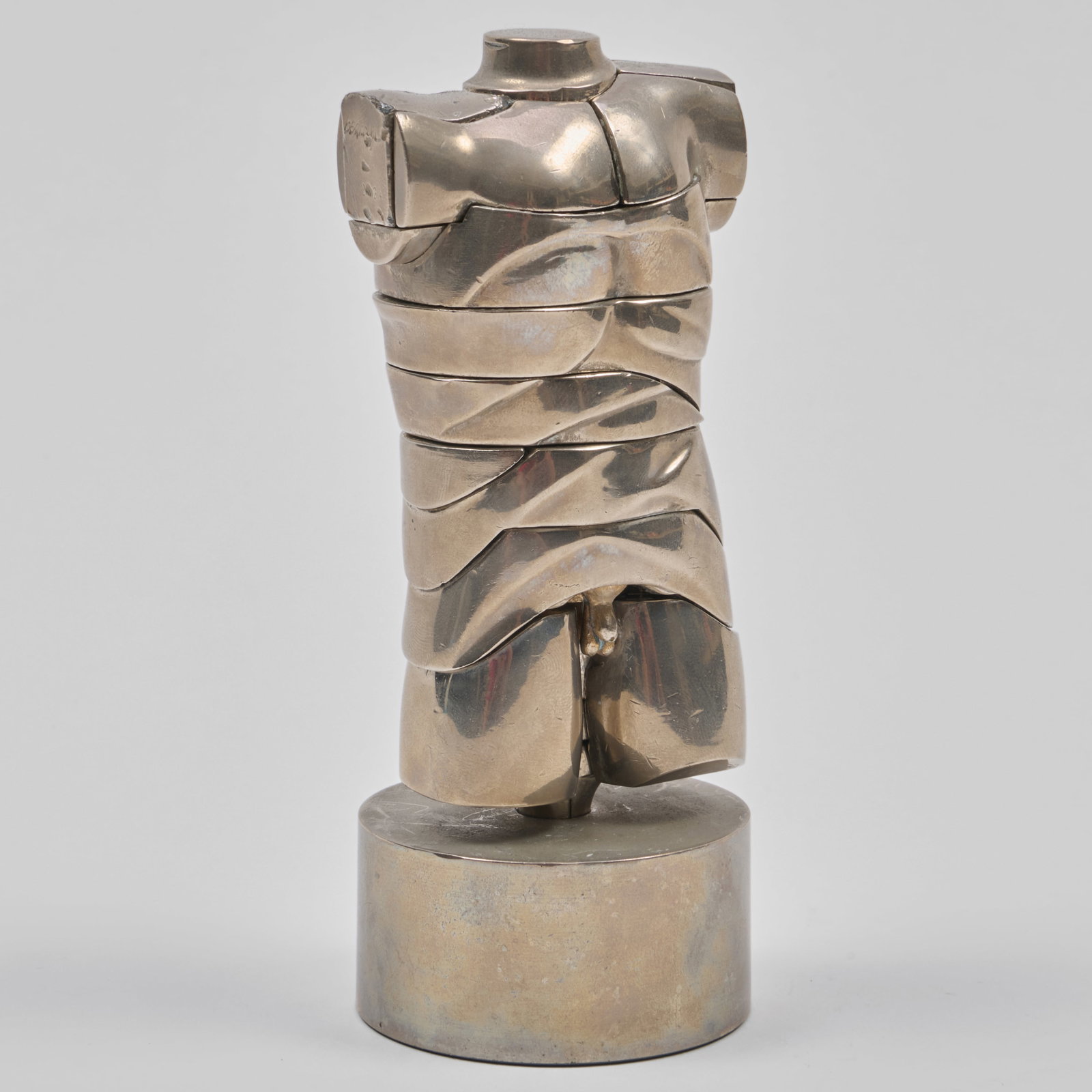 Miguel Berrocal (1933-2006): Mini David (Opus 107): Polished nickel-plated Zamak metal on a metal base,1969, signed 'Berrocal' and numbered 2424 on the left shoulder component (the edition was 10000). 5 1/2 x 2 1/2 x 2 1/2 in. (with base).