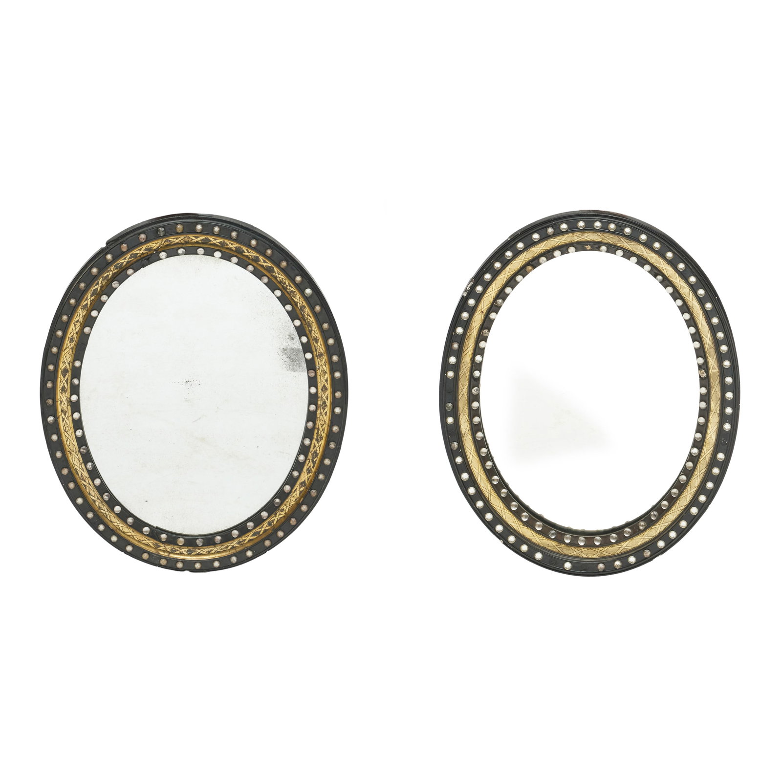 Near Pair of Irish Ebonized, Parcel-Gilt and Beaded Oval Mirrors: 29 1/2 x 23 1/4 in. 28 1/2 x 22 in. in.