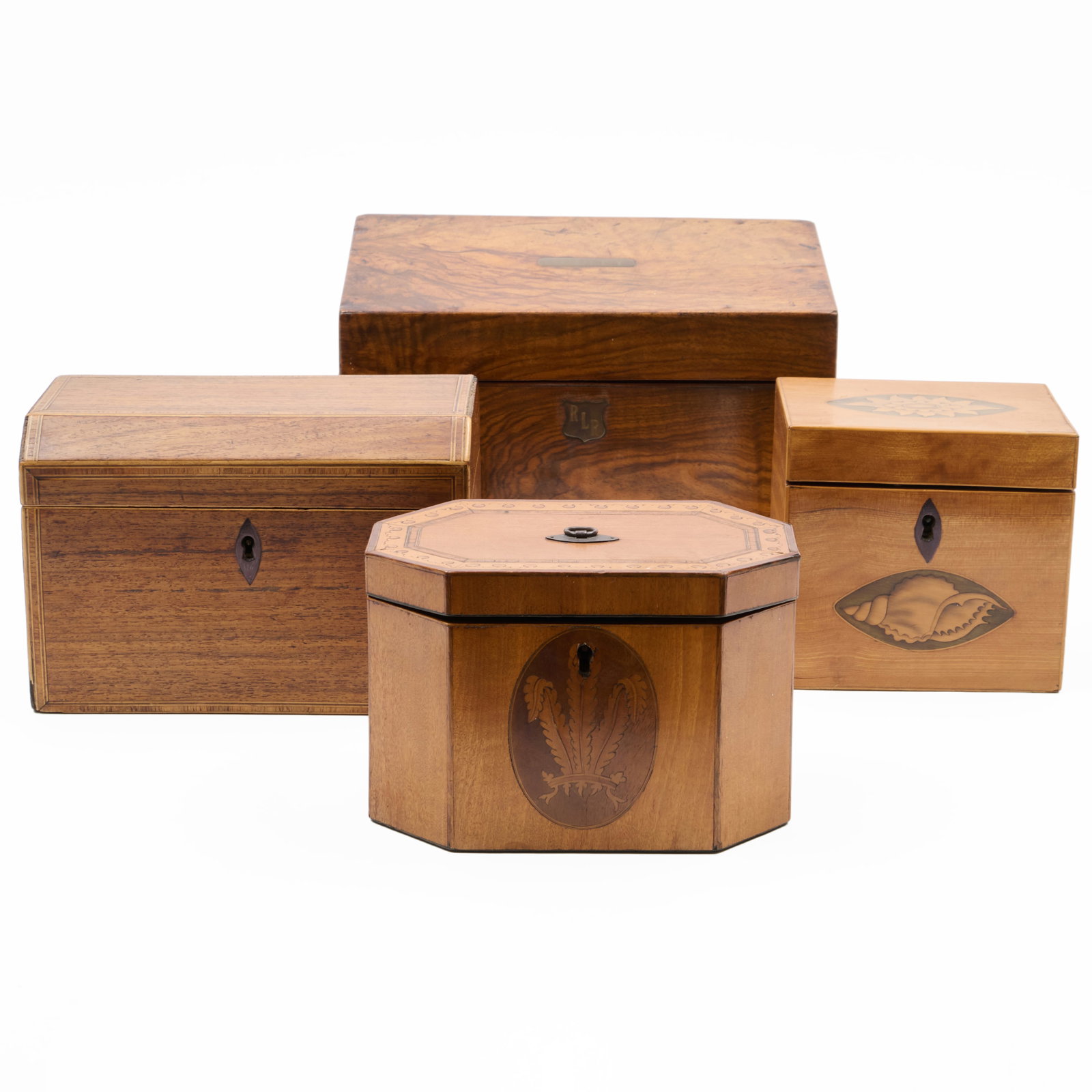 Group of Four English Tea Caddies: 6 1/4 x 9 1/2 x 5 in., the largest.4 1/2 x 4 3/4 x 4 in., the smallest.