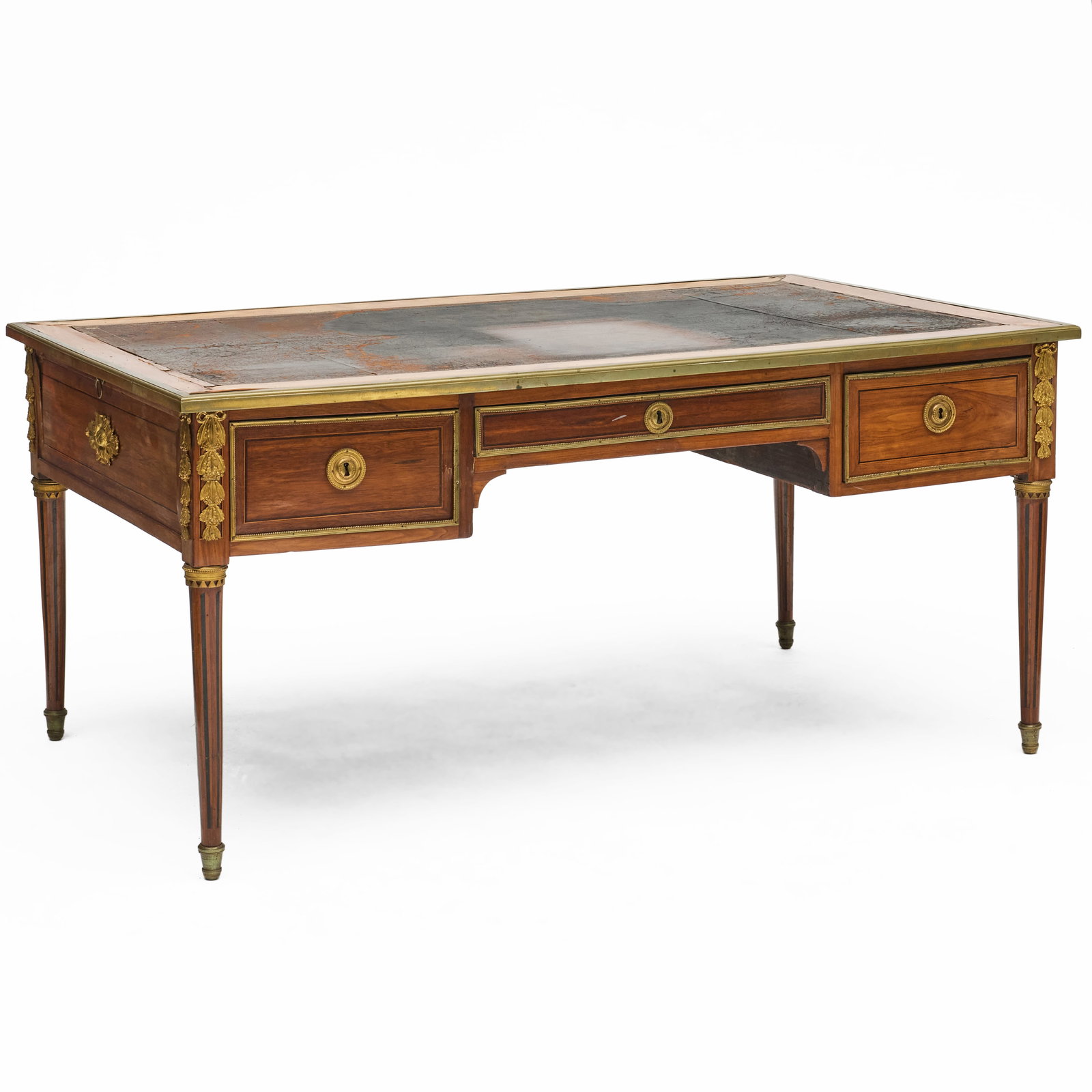 Louis XVI Brass and Ormolu-Mounted Ebony and Fruitwood-Inlaid Bois Satine Bureau Plat: Louis XVI Brass and Ormolu-Mounted Ebony and Fruitwood-Inlaid Bois Satine Bureau Plat Fitted with an inset gilt-tooled leather writing surface and three drawers. With four keys. 30 x 5 ft. 4 x 38 in.