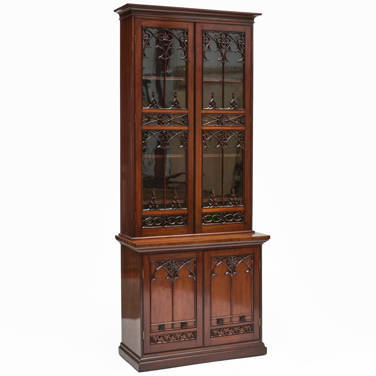 Northern European Neo-Gothic Mahogany Bookcase Cabinet: Northern European Neo-Gothic Mahogany Bookcase Cabinet In two parts, the upper section with four shelves and the lower with fitted drawers and one shelf. With two keys. 8 ft. x 39 1/4 x 18 in. Paul de