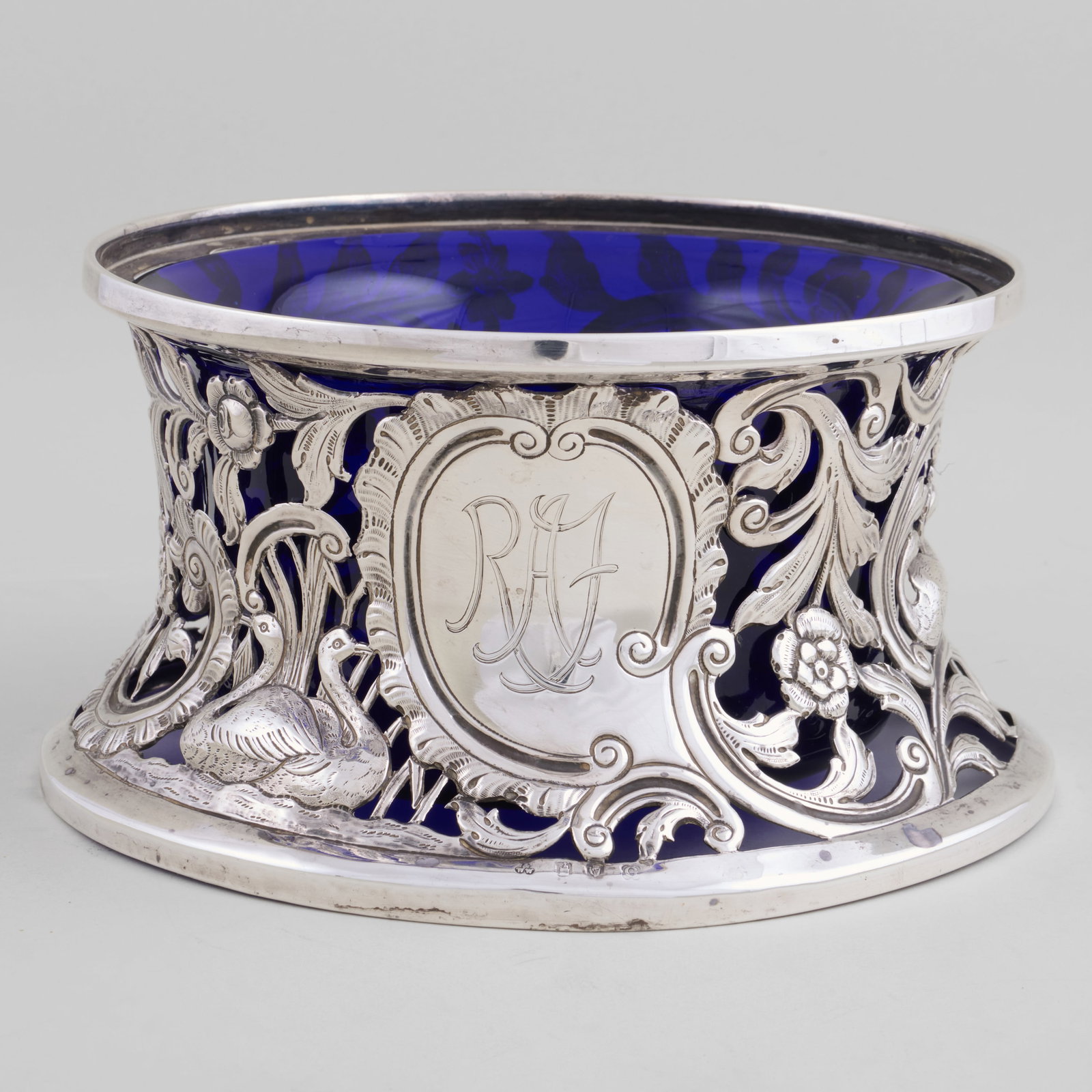 Irish George V Silver Dish Collar: Irish George V Silver Dish Collar Mark of Wakely & Wheeler, Dublin, 1918, monogrammed; together with a blue glass liner.4 1/8 x 7 7/8 in. diam., 10.6 oz. approx. weight.