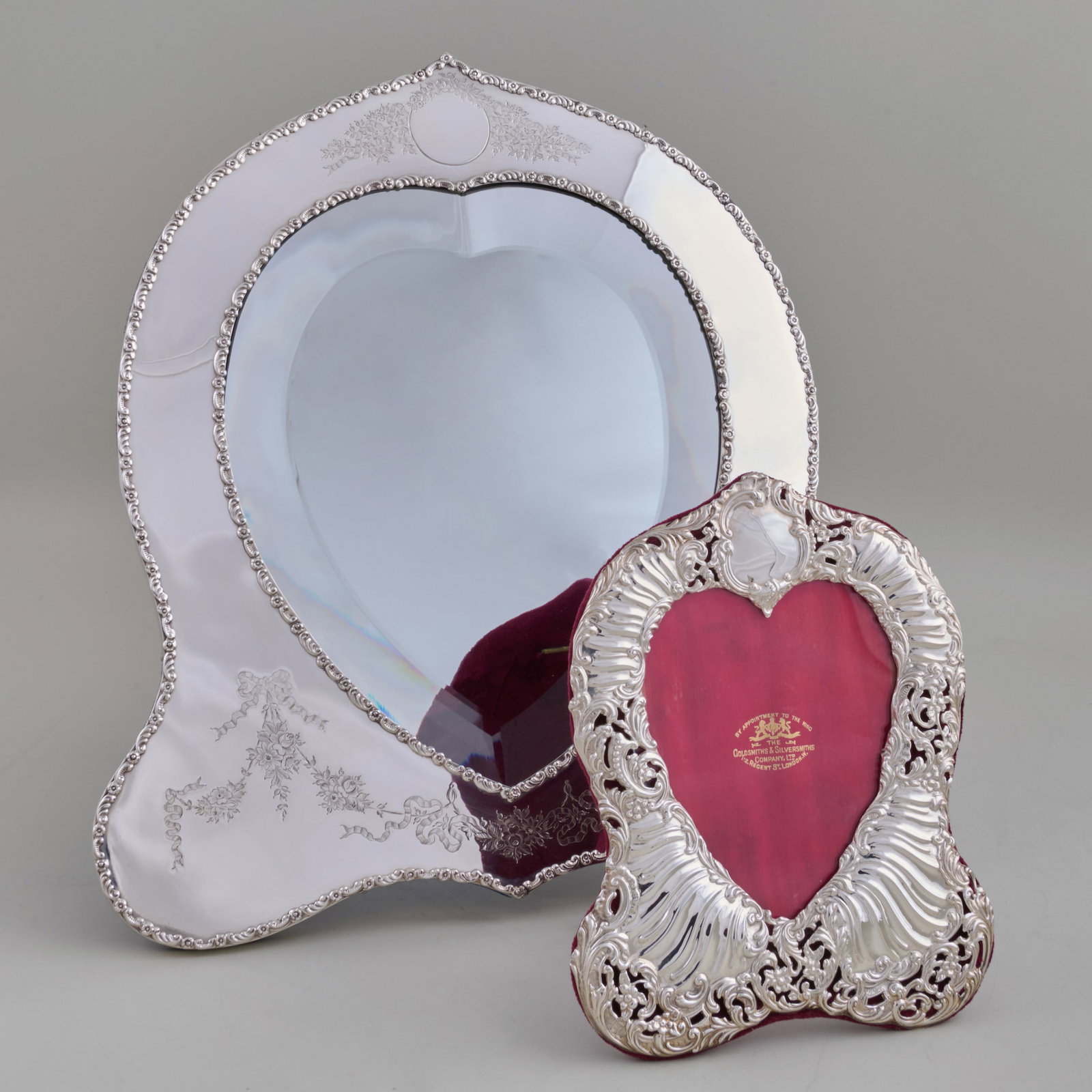 Two Edward VII Silver Frames: Two Edward VII Silver Frames The larger fitted with a mirror plate, mark of Silversmiths & Goldsmiths Ltd., London, 1904; the smaller Silversmiths & Goldsmiths Ltd., London,1902.The larger 13 x 12