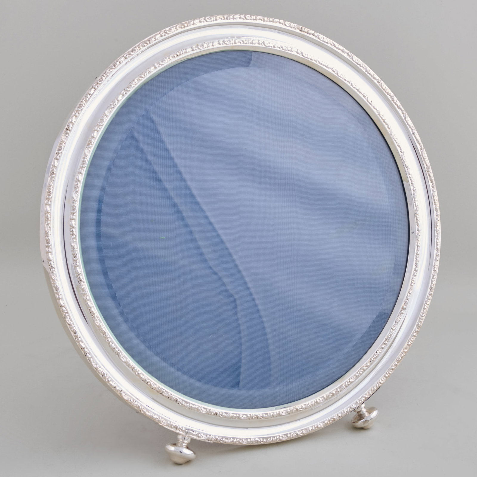 Edward VII Silver Circular Frame: Edward VII Silver Circular Frame Marked Birmingham, 1908, maker's mark 'HM'.13 1/2 in. diam. Property from the Jordan Saunders Collection