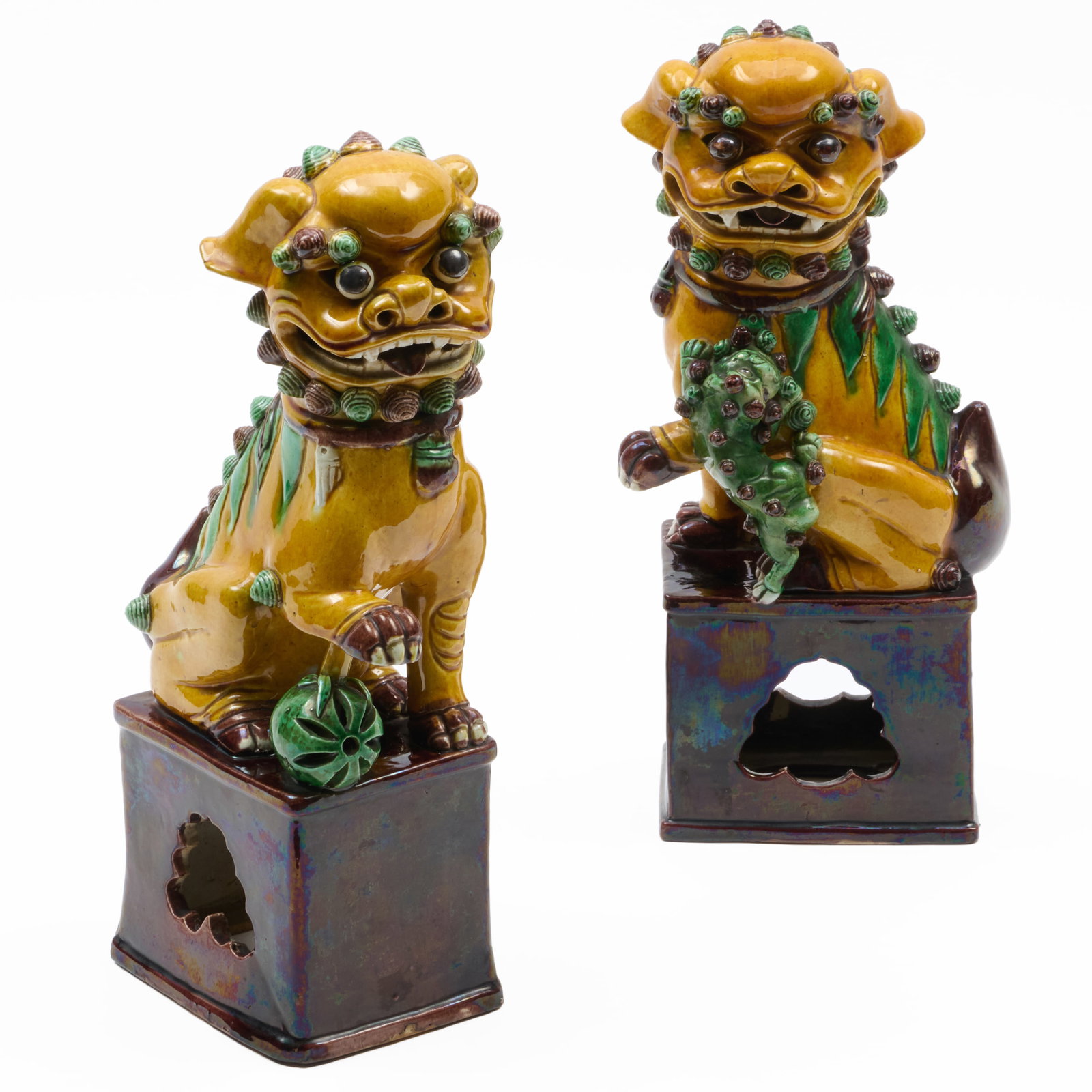 Pair of Chinese Sancai Glazed Porcelain Buddhistic Lions: Pair of Chinese Sancai Glazed Porcelain Buddhistic Lions Unmarked.14 x 7 x 4 1/4 in.