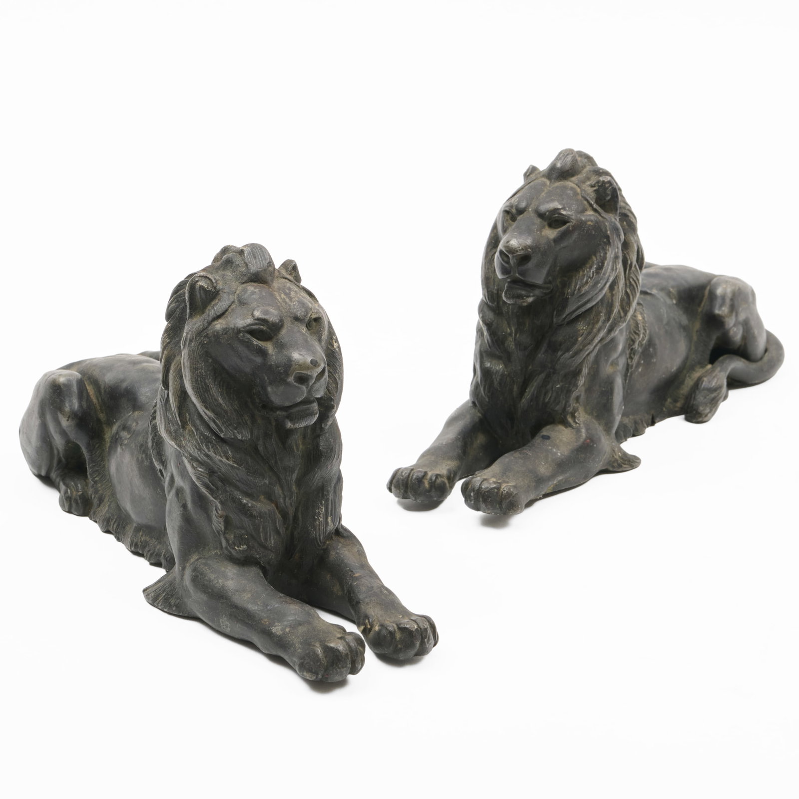 Pair of Patinated Metal Lions: Pair of Patinated Metal Lions 5 x 10 x 3 1/2 in. The Collection of James M. Labaugh Antiques, Pound Ridge, NY.