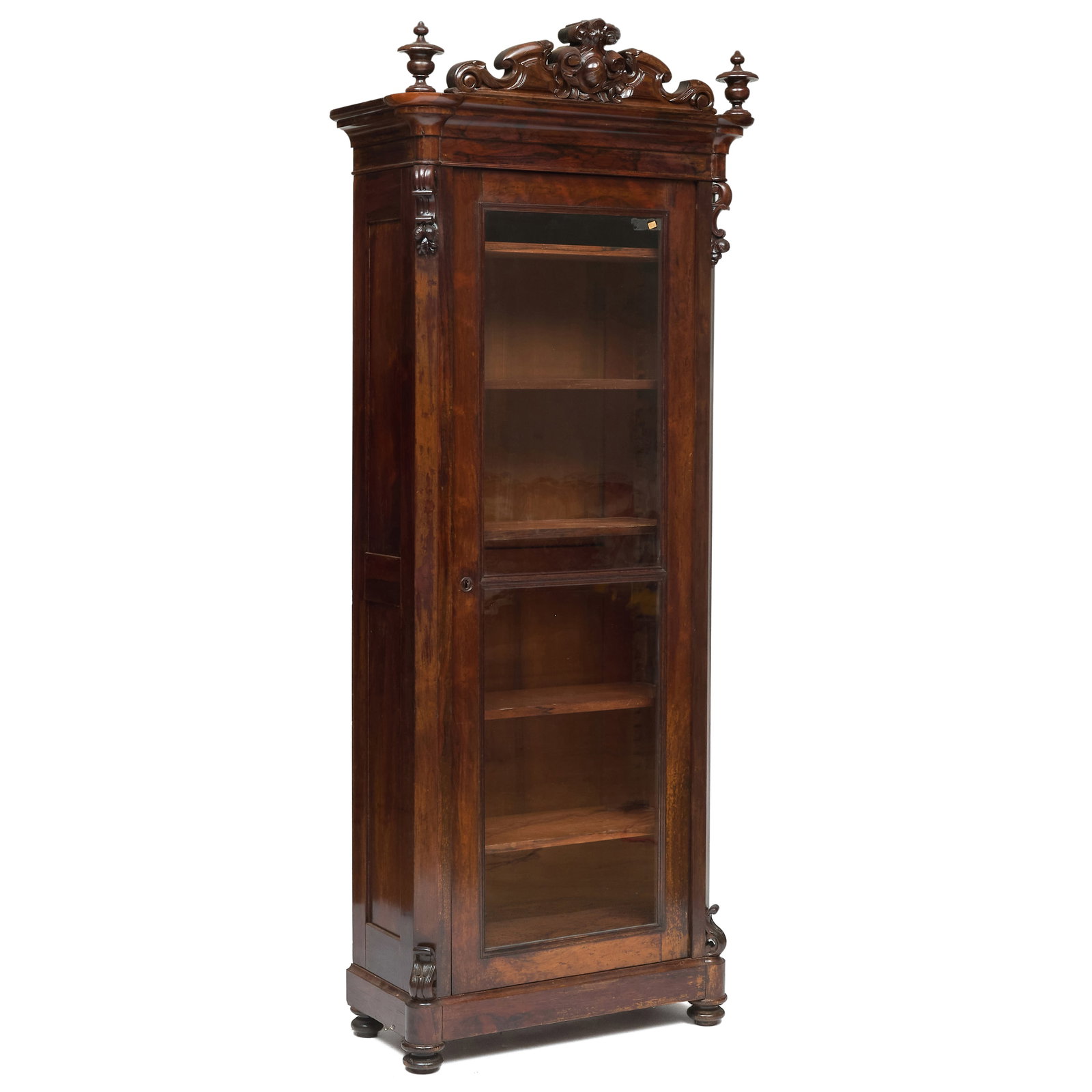 Rococo Revival Carved Rosewood Single Door Bookcase: Rococo Revival Carved Rosewood Single Door Bookcase One key.86 x 32 x 14 in. Property from the Collection of Joan Bogart