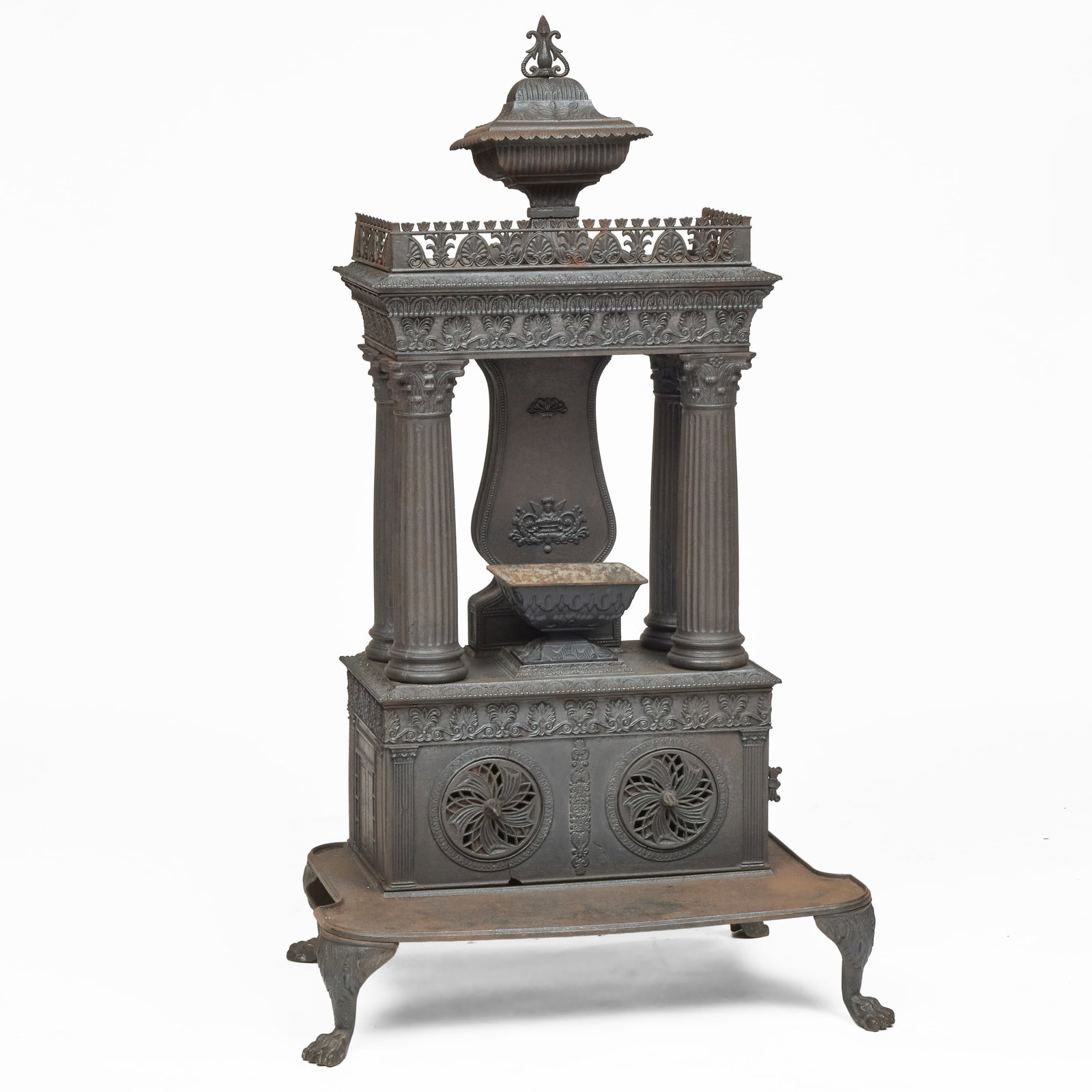 Classical Cast Iron Parlor Column Stove: Classical Cast Iron Parlor Column Stove 57 x 32 x 20 in. Note: A nearly identical example to this stove is found in the collection of The Metropolitan Museum of Art (accession no. 53.132.1a-I). While 