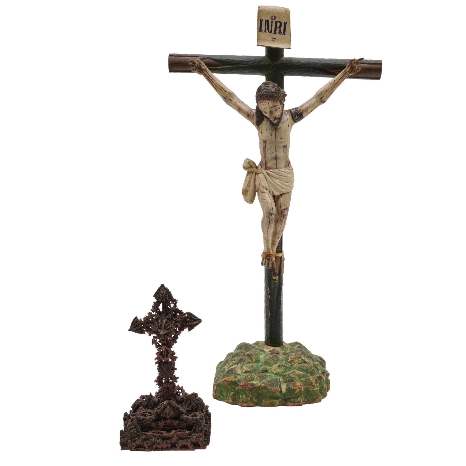 Two Folk Art Crucifixes: Two Folk Art Crucifixes The first polychromed wood, the second painted nut sections.The first 20 x 11 x 5 in., the second 7 1/2 x 4 x 4 in. The Collection of Roger S. Wieck and Jean-Francois Vilain: