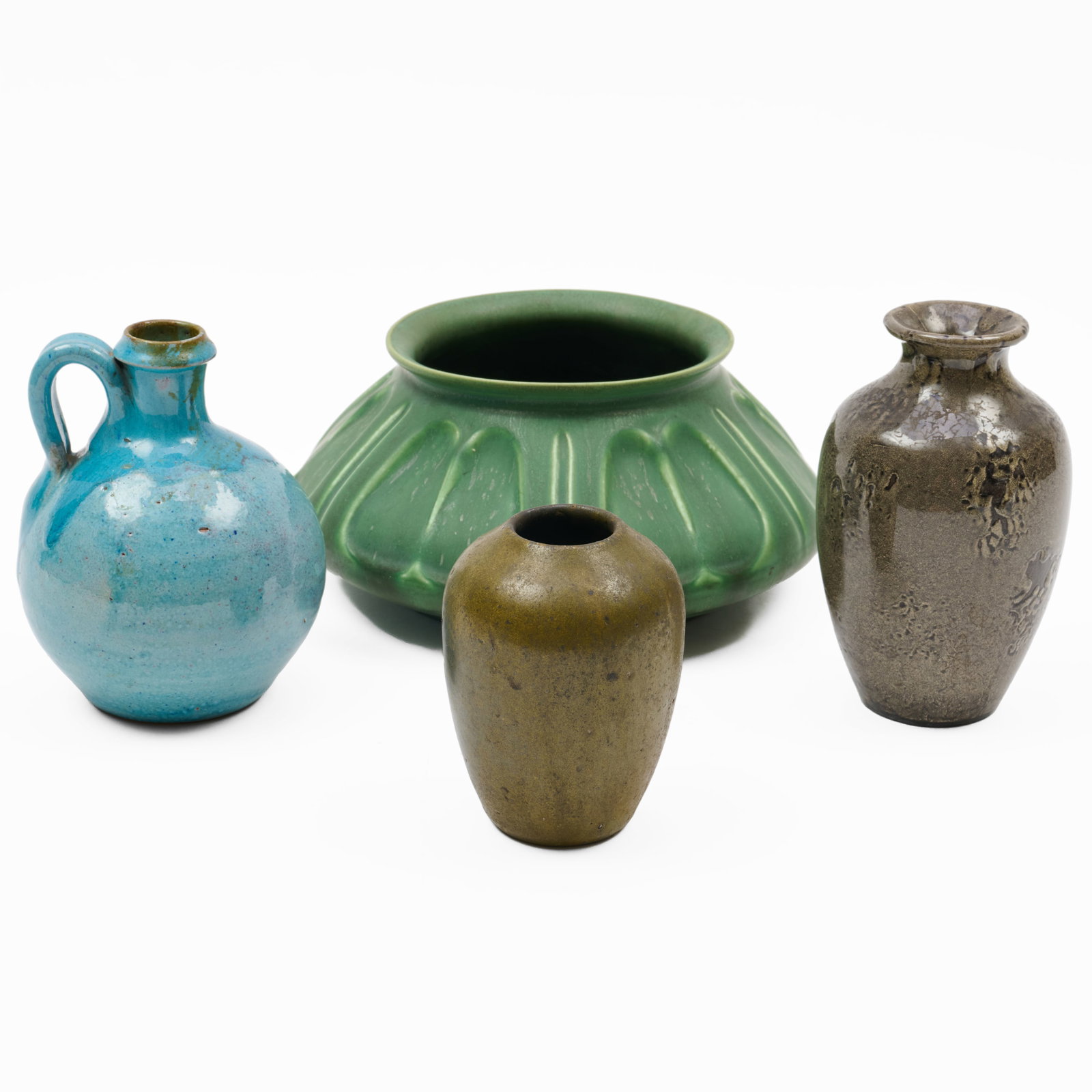 Group of Four Art Pottery Vessels: Group of Four Art Pottery Vessels Each with impressed mark.Comprising:A Hampshire green glazed squat vaseA North State blue glazed jug A Jugtown green glazed vaseA mottle glazed vase</