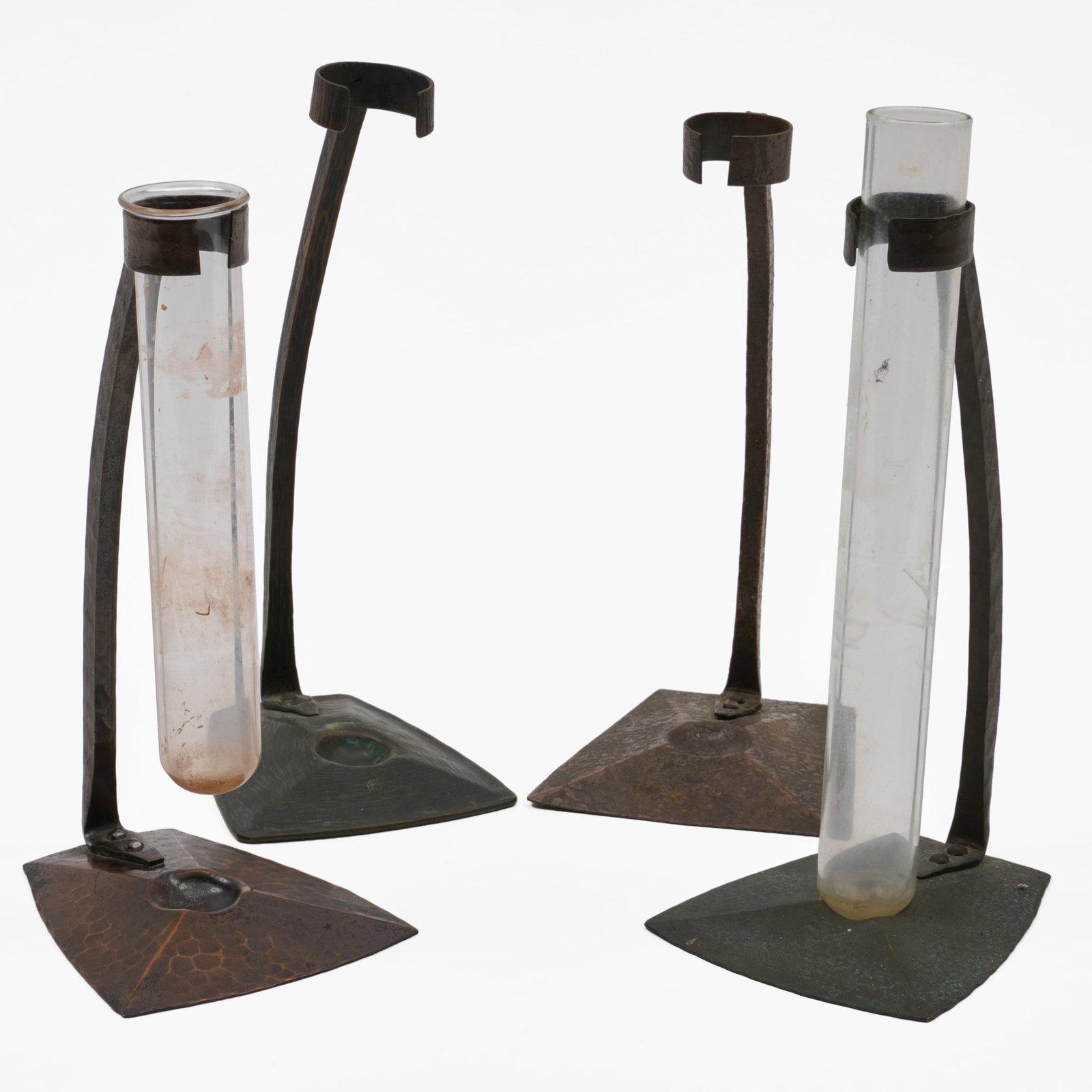 Group of Four Roycroft Copper Bud Vase Supports: Group of Four Roycroft Copper Bud Vase Supports Stamped marks; together with two glass bud vials.The largest 7 3/4 x 3 1/2 x 3 1/8 in. The Collection of Roger S. Wieck and Jean-Francois Vilain: Sold t