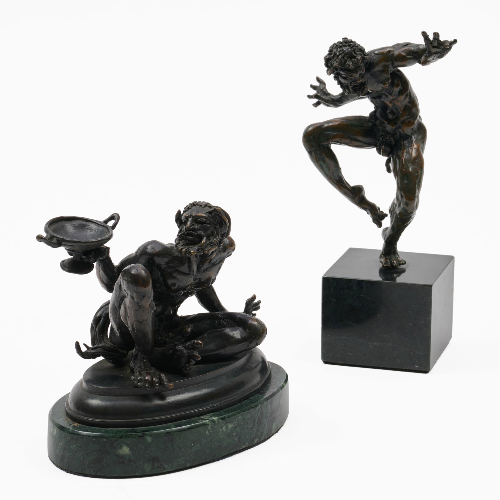 Campbell Glynn Paxton (b. 1948): Dancing Satyr; and Naxian Silenos: Campbell Glynn Paxton (b. 1948): Dancing Satyr; and Naxian Silenos Two bronze, both signed with initials 'CGP' at back, Silenos numbered 2, both on green marble bases. 7 1/2 in. (height with base). an