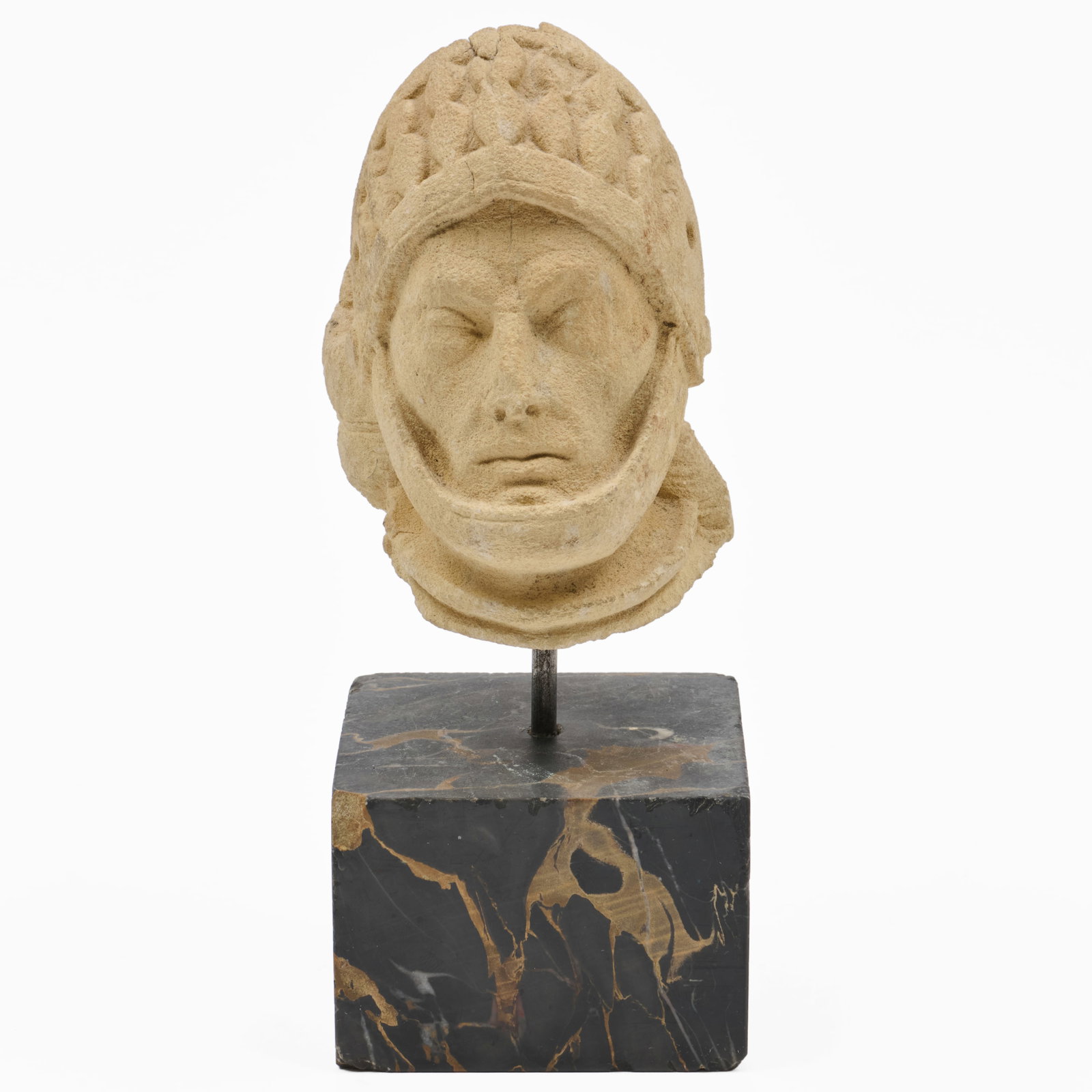 French or German Carved Stone Head of a Knight: French or German Carved Stone Head of a Knight Raised on marble base. The head 4 3/4 x 3 1/2 x 3 1/2 in., 8 1/4 x 3 1/4 x 3 1/4 in. (overall). The Collection of Roger S. Wieck and Jean-Francois