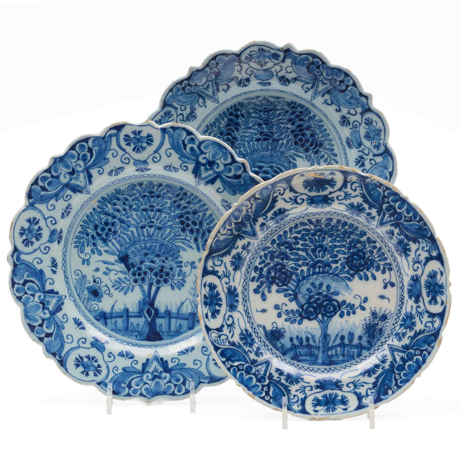 Pair of Delft Blue and White Plates and Similar Plate: Pair of Delft Blue and White Plates and Similar Plate The pair with blue painted hatchet mark, possibly for De Porceleyne Bijl, the single with a blue painted monogram over a line and star mark.The