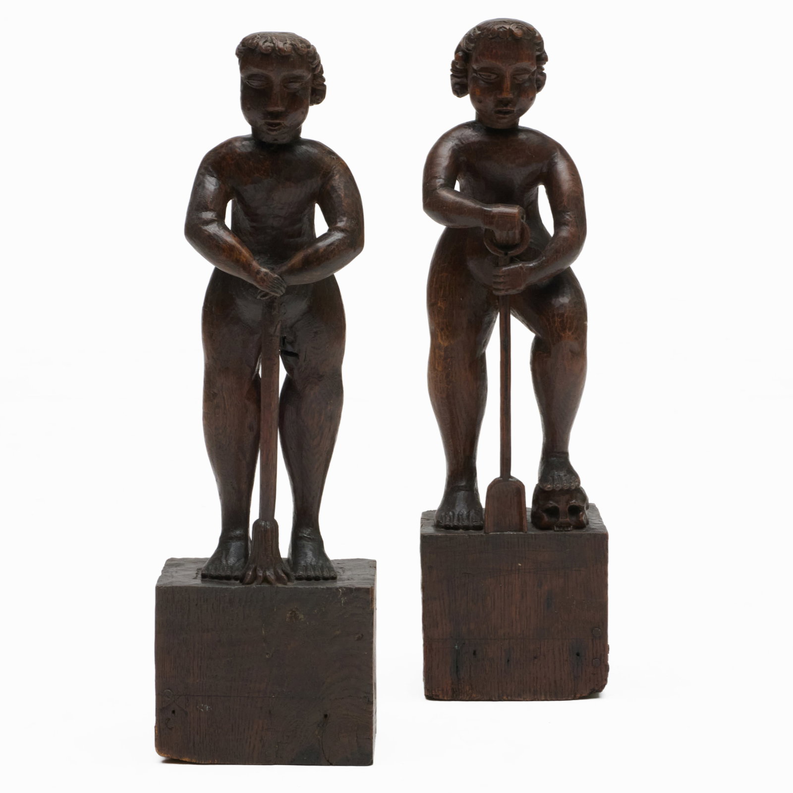 Two English Oak Figural Elements: Two English Oak Figural Elements One a gravedigger with a shovel and skull, the other with a broom. 23 1/2 x 6 1/2 x 4 3/4 in. The Collection of a Private Connecticut Collector.