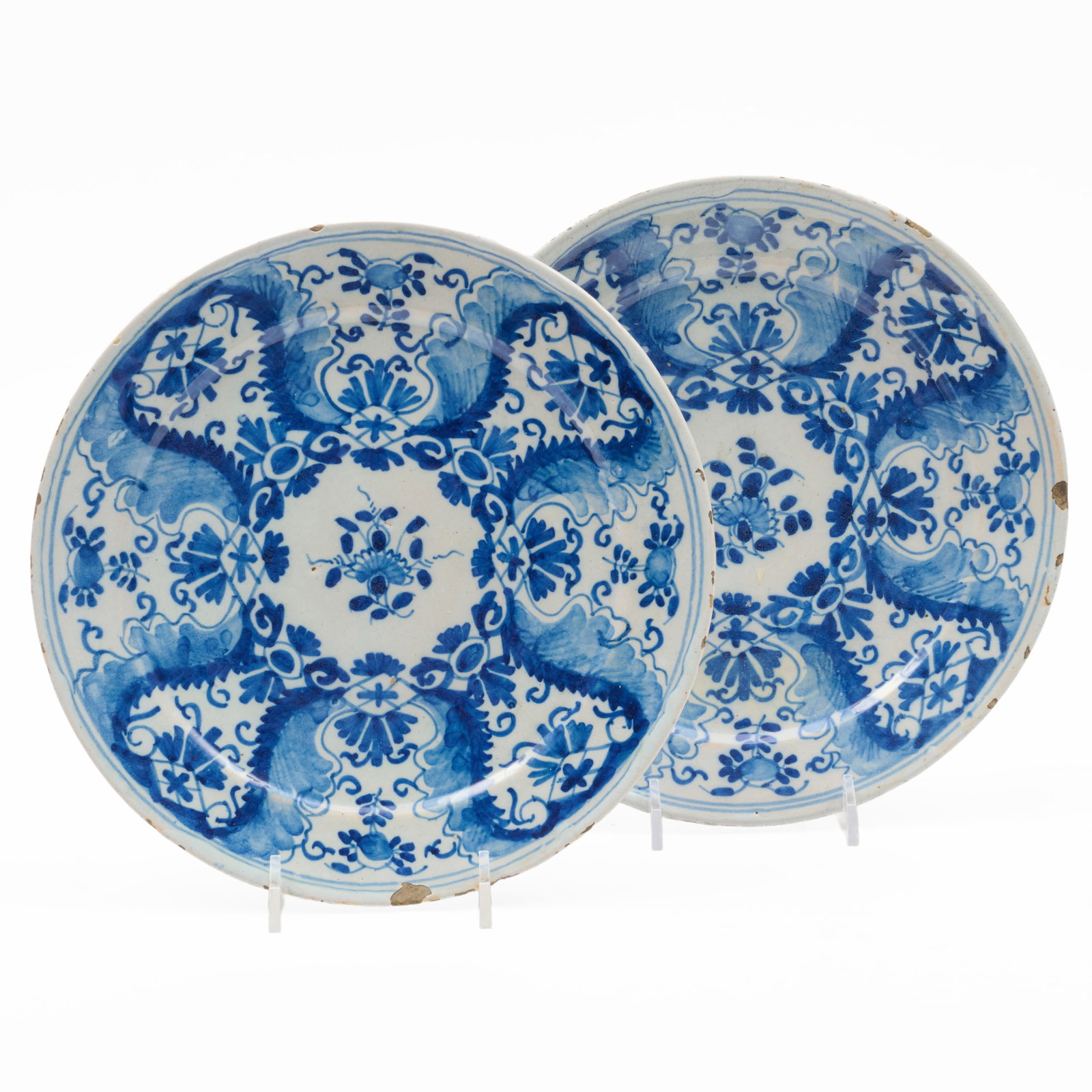 Pair of Delft Blue and White Dishes: Pair of Delft Blue and White Dishes Blue printed marks.8 1/2 in. diam. Applied label for Ensigner Antiques, Palm Beach, FL.