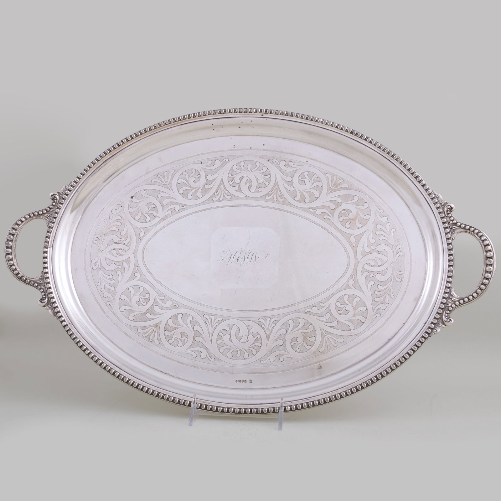 Two Dixon & Sons Silver Plate Monogrammed Trays in Two Sizes: Two Dixon & Sons Silver Plate Monogrammed Trays in Two Sizes The smaller raised on four feet.The smaller 7 1/2 x 10 in., the larger 14 x 21 1/2 in. Property from the Munson Museum of Art, Utica, NY, S
