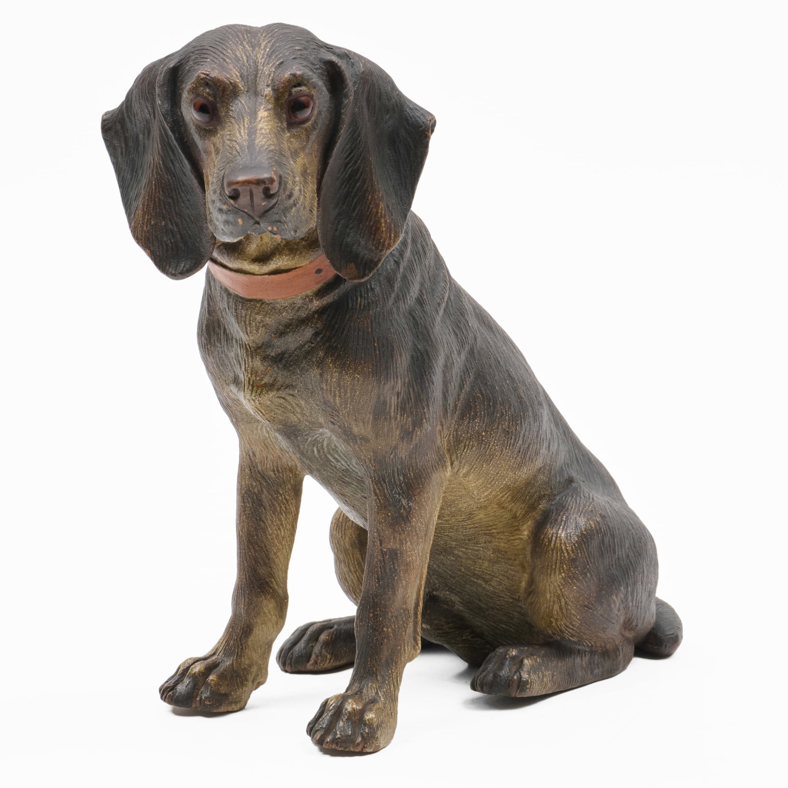 German Painted Ceramic Figure Of A Hound: German Painted Ceramic Figure Of A Hound With glass eyes, unmarked. 10 1/4 in. Property from the Collection of a Distinguished NY Lady, with Interiors by Alex Papachristidis.