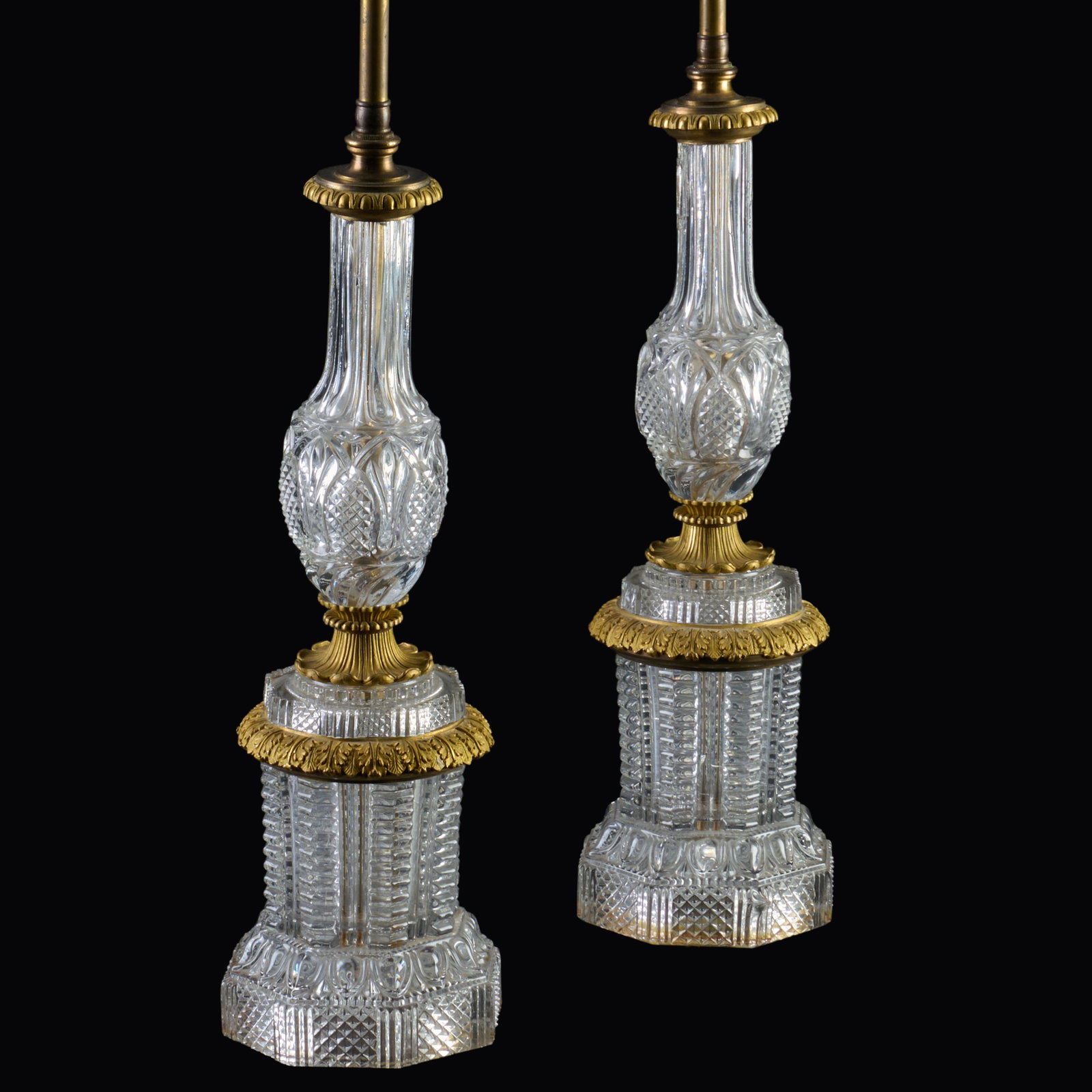 Pair Of Gilt-Bronze, Brass And Cut Glass Lamps: Pair Of Gilt-Bronze, Brass And Cut Glass Lamps 27 1/4 x 5 1/2 in. diam., the base. Property from the Collection of a Distinguished NY Lady, with Interiors by Alex Papachristidis.