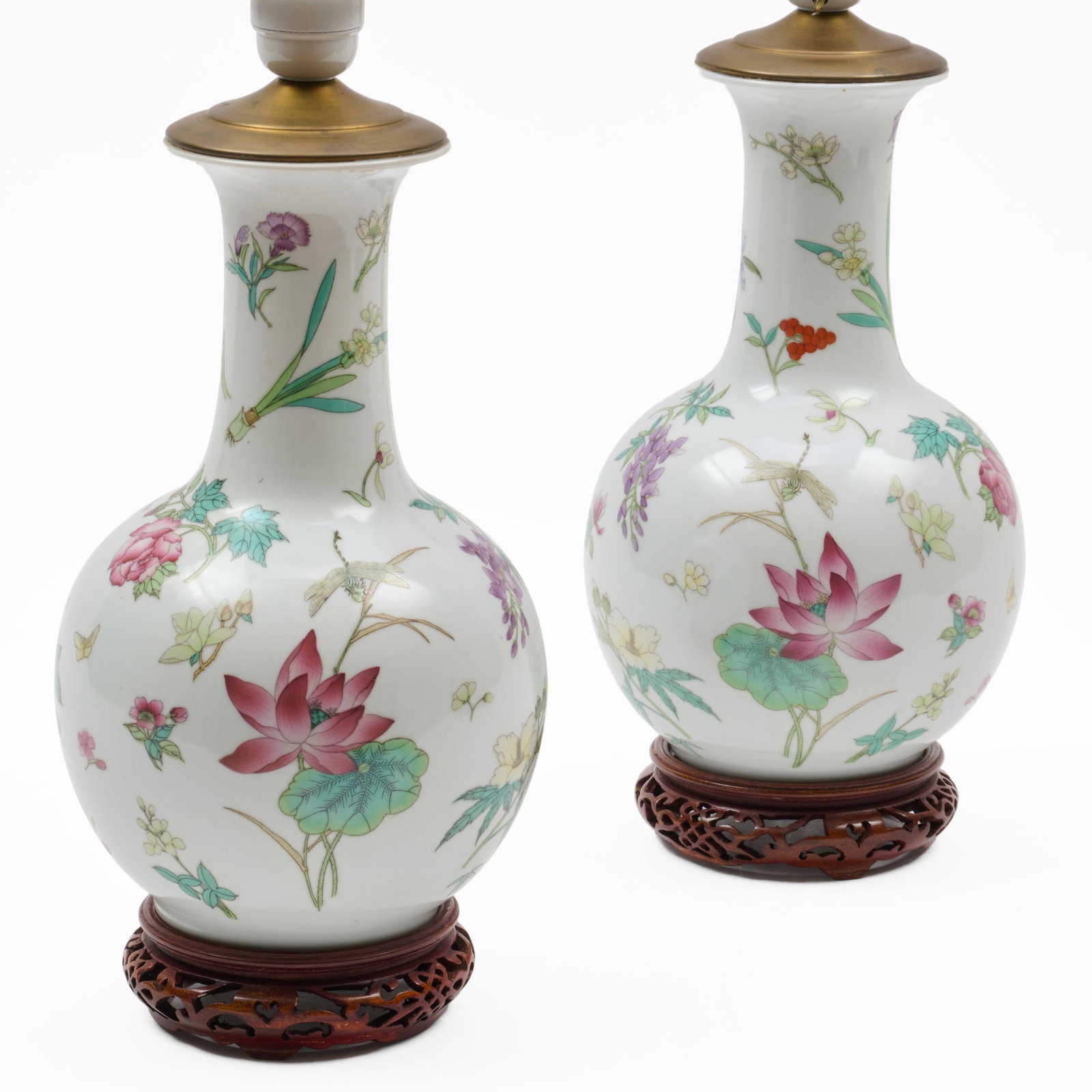 Pair Of Chinese Famille Rose Porcelain Vases Mounted As Lamps: Pair Of Chinese Famille Rose Porcelain Vases Mounted As Lamps Stamped on underside. The vase 11 x 6 1/2 in. diam., 14 x 6 1/2 in. diam. (to socket).